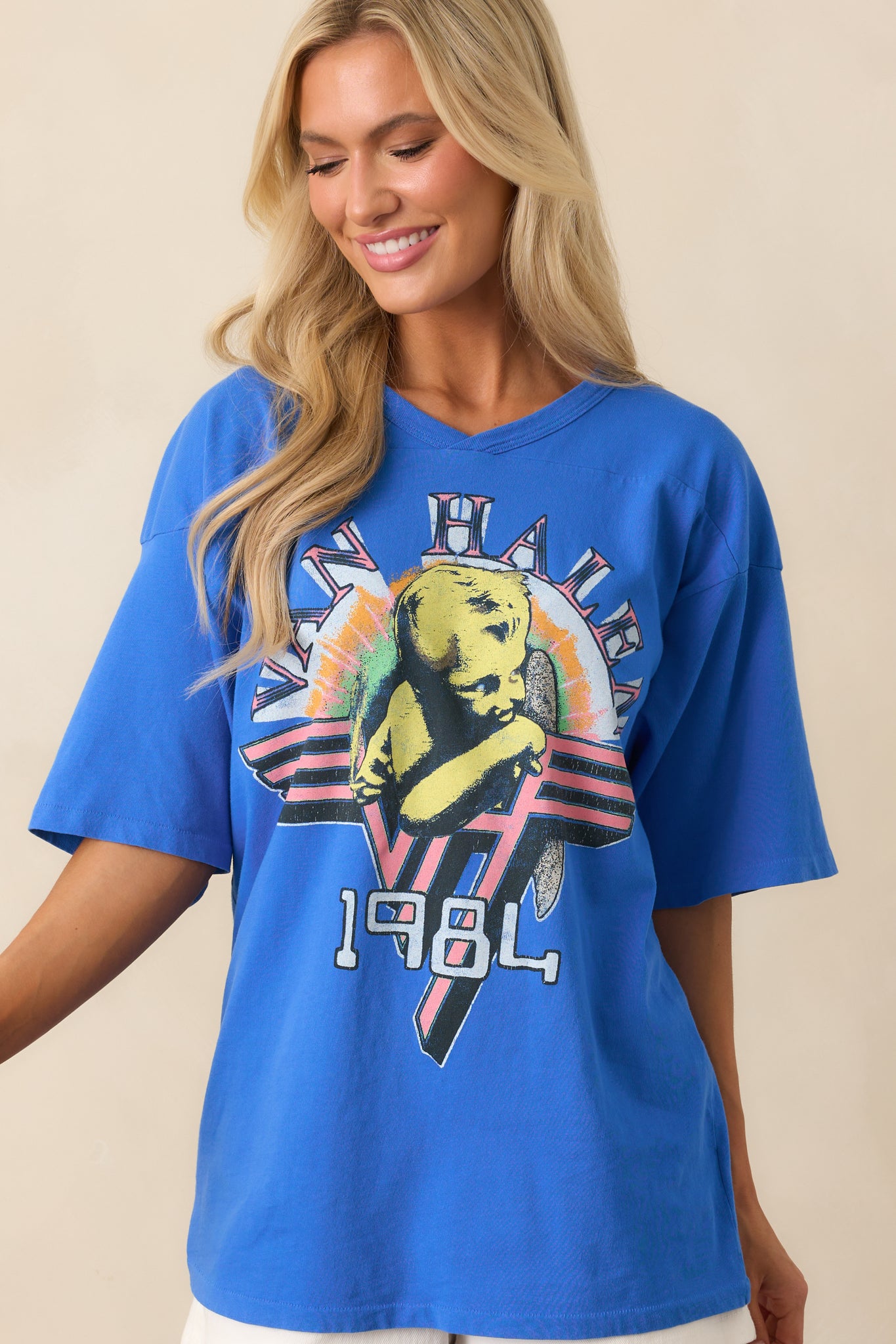 Partial front view of the oversized tee showing the drape of the cotton fabric around the torso.