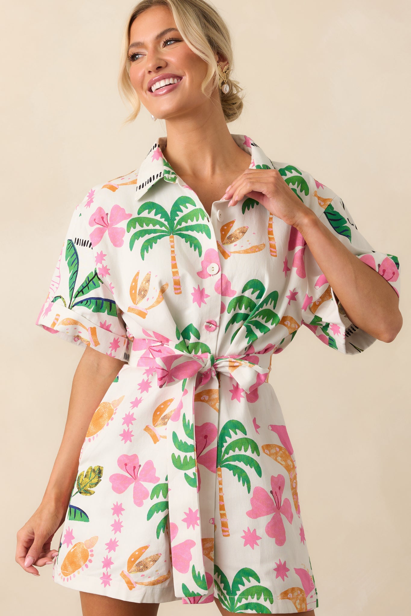 Zoomed-in view of the upper half highlighting the collared neckline, functional buttons, and structured short sleeves.