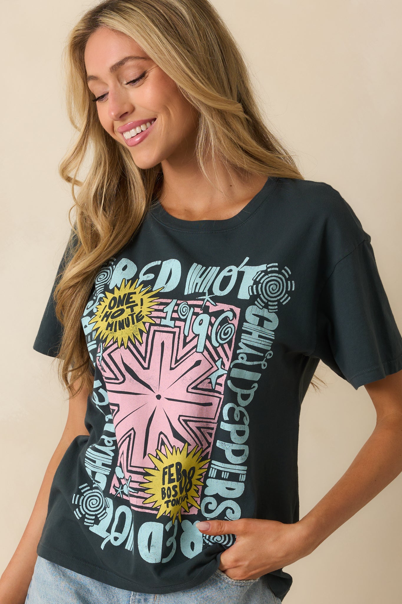 A front view showing the crew neckline and oversized silhouette of the graphic tee.