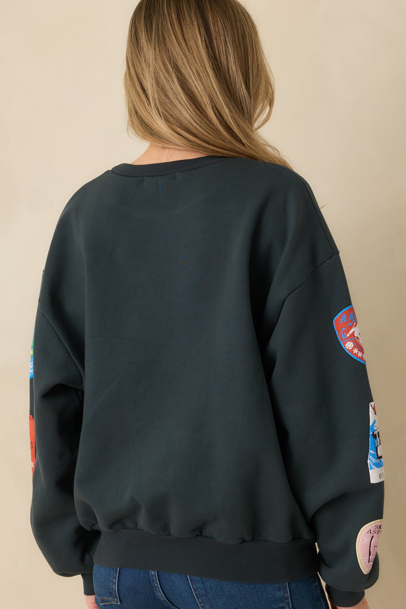 Vintage black sweatshirt showing smooth rear fabric and relaxed ribbed trim.