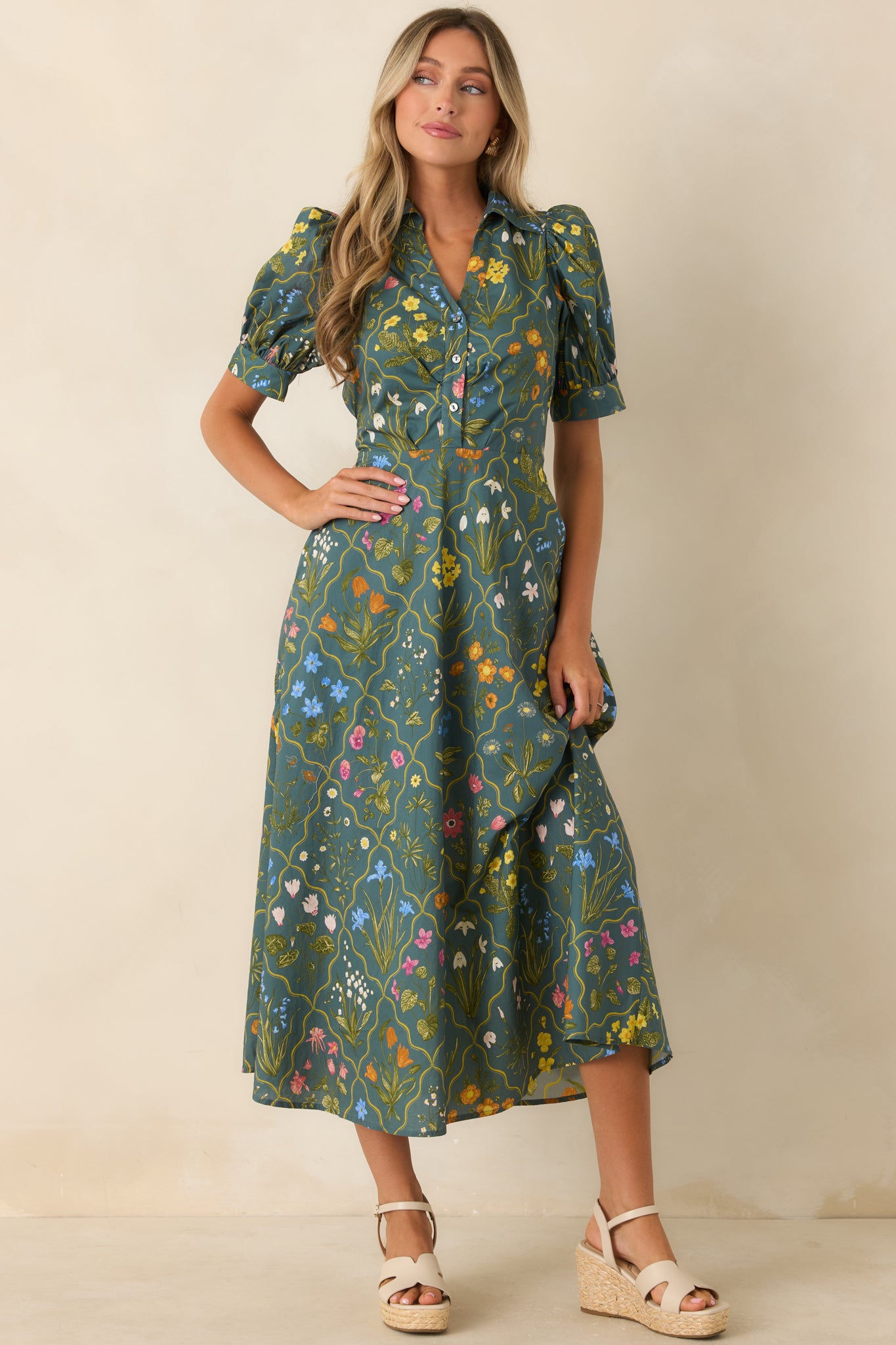 Vintage-inspired botanical midi dress designed with an adjustable self-tie sash, elastic back waistband, and hidden side pockets.