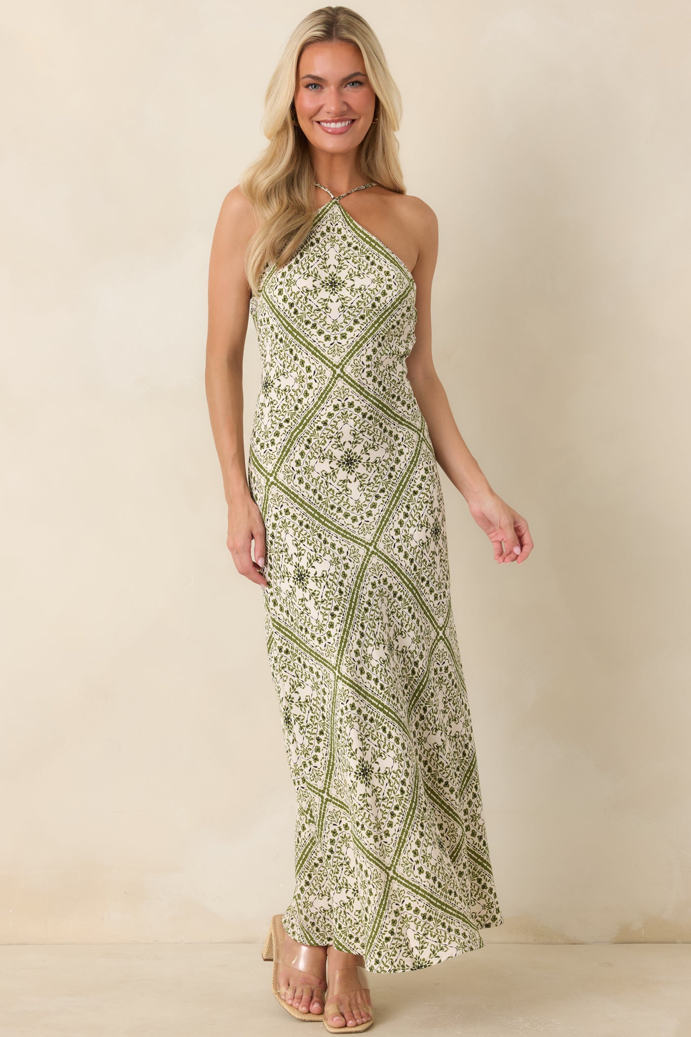 Vintage-inspired floral midi dress with an elegant column shape and softly skimming silhouette.