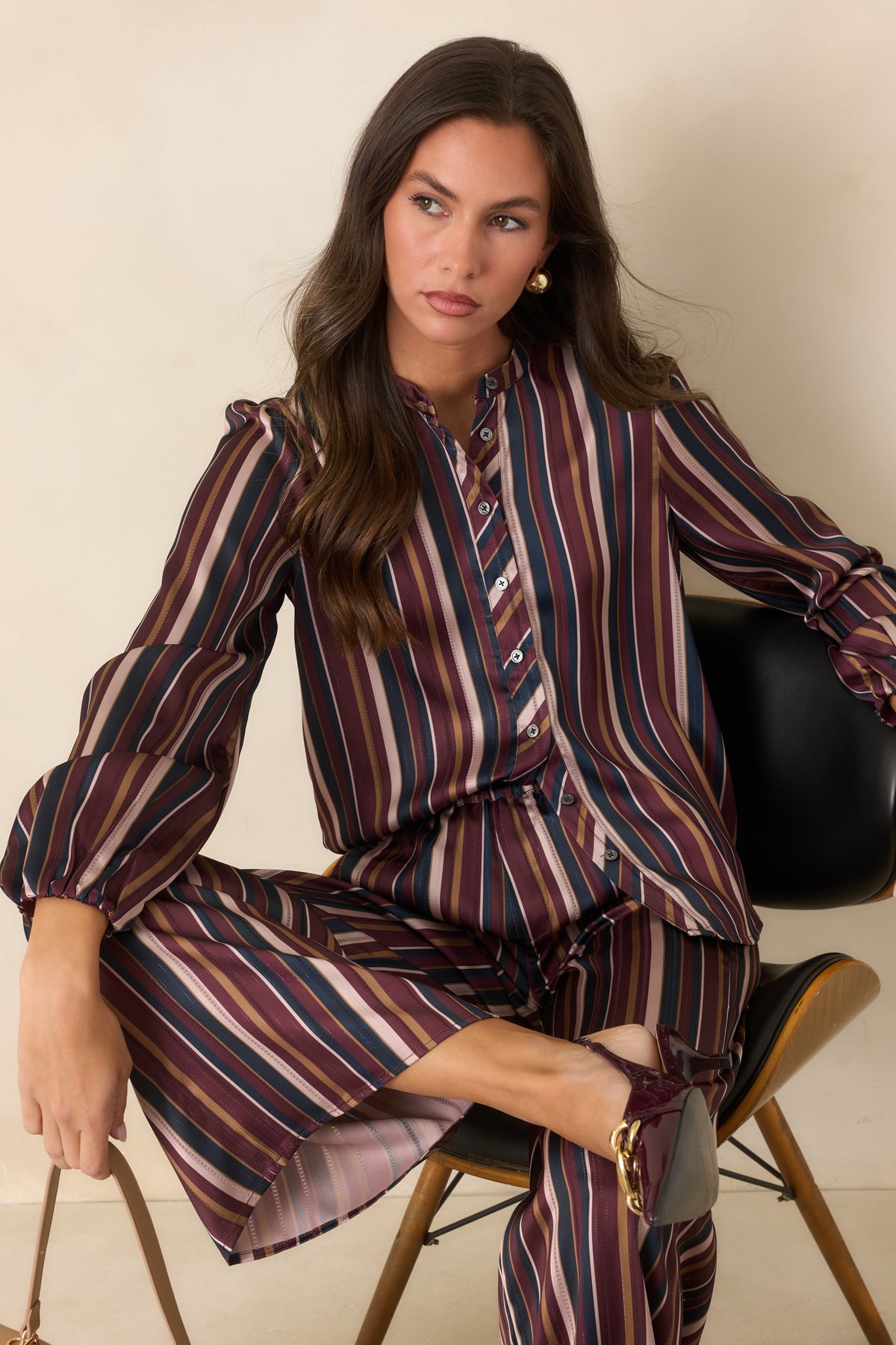 Vintage-inspired satin blouse showcasing burgundy, navy, champagne, and olive stripes.
