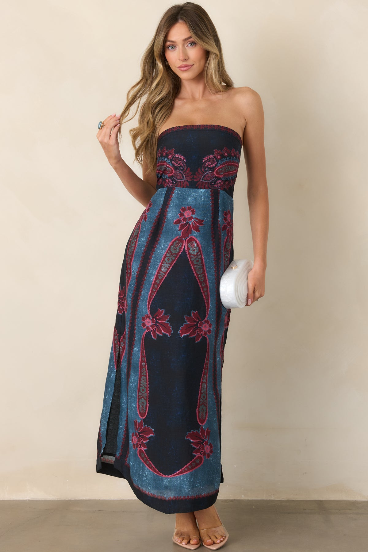Vintage-inspired scarf print dress featuring a fitted bodice, straight strapless neckline, deep navy and teal panels, and a flowing skirt.