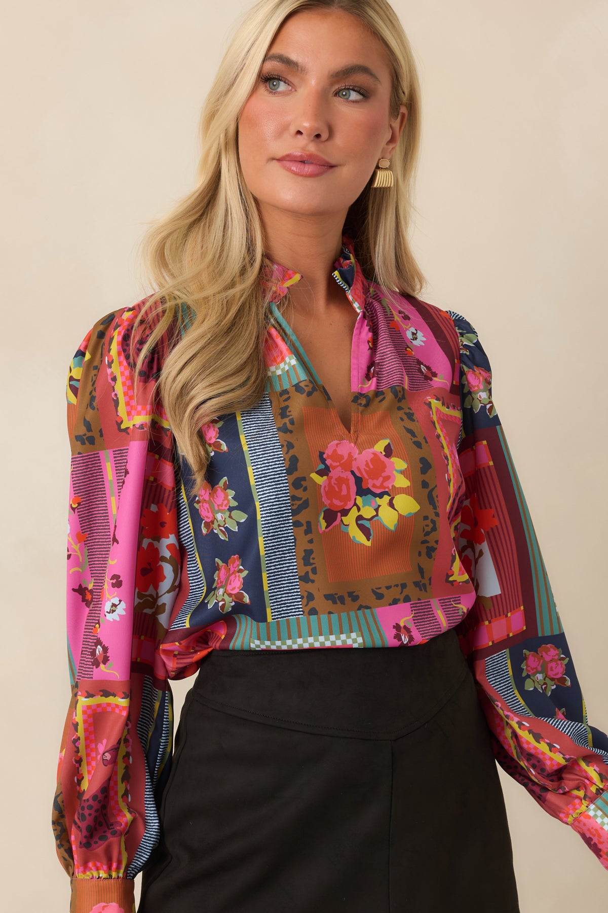 The Vintage Vignette print combines framed motifs, bold colors, and florals across this lightweight blouse.