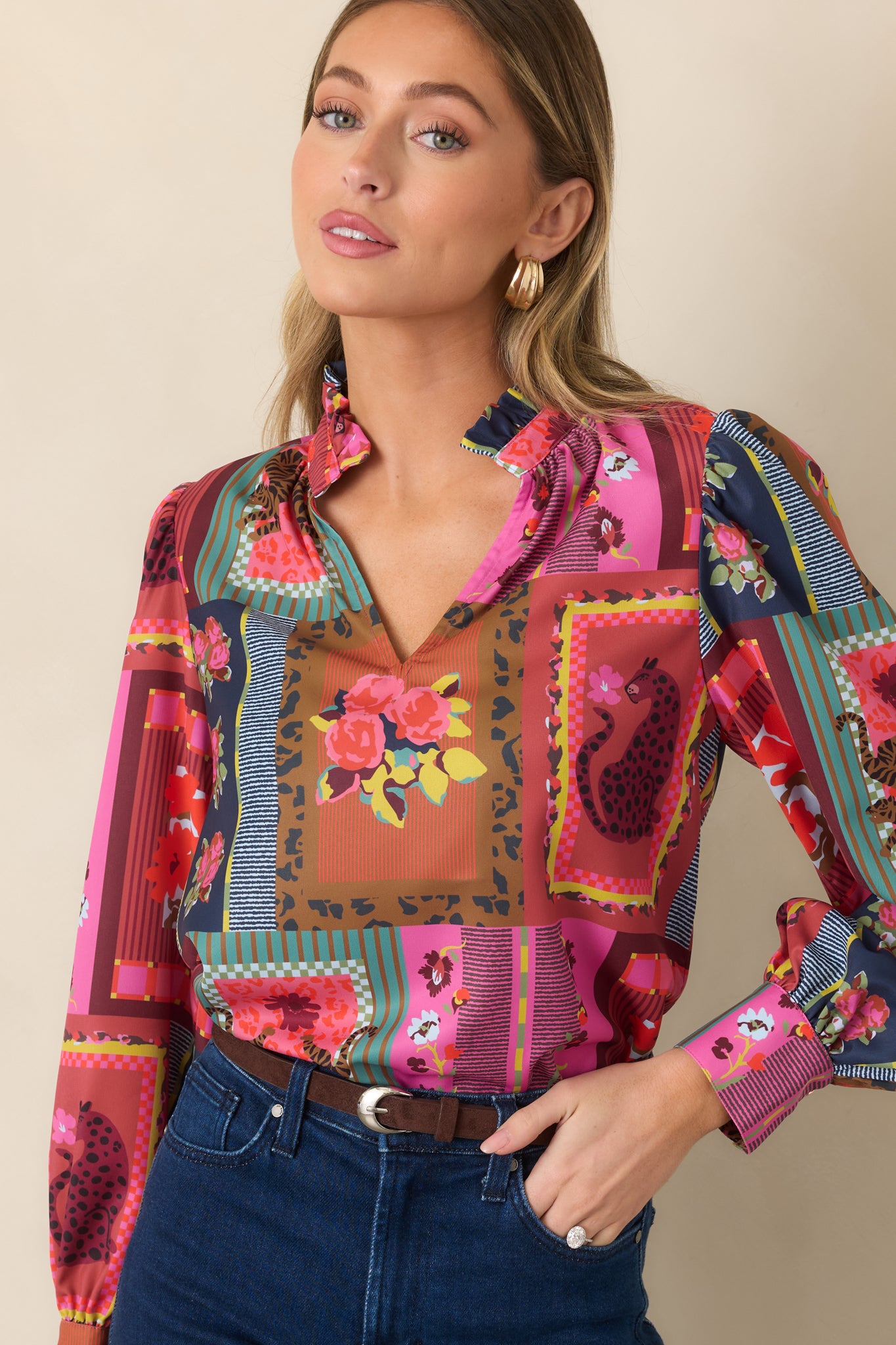 Vintage Vignette top detail highlighting the ruffled split neckline, gathered shoulder seams, and vibrant combination of floral and geometric motifs.