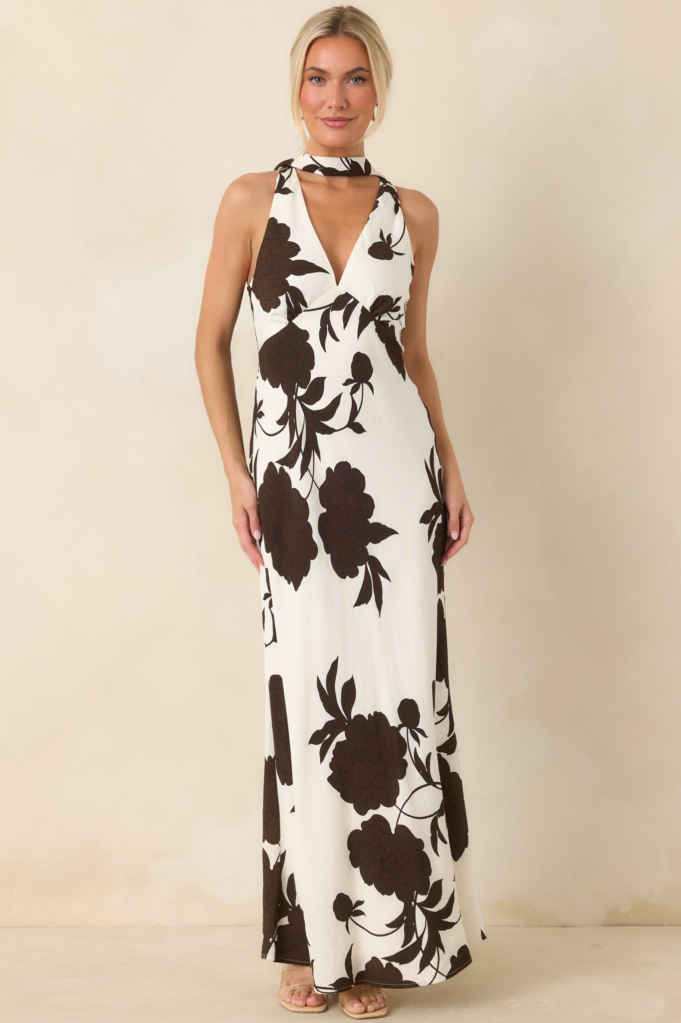 Viscose blend maxi dress featuring a bias-cut silhouette, plunging V-neckline, and matching scarf detail.
