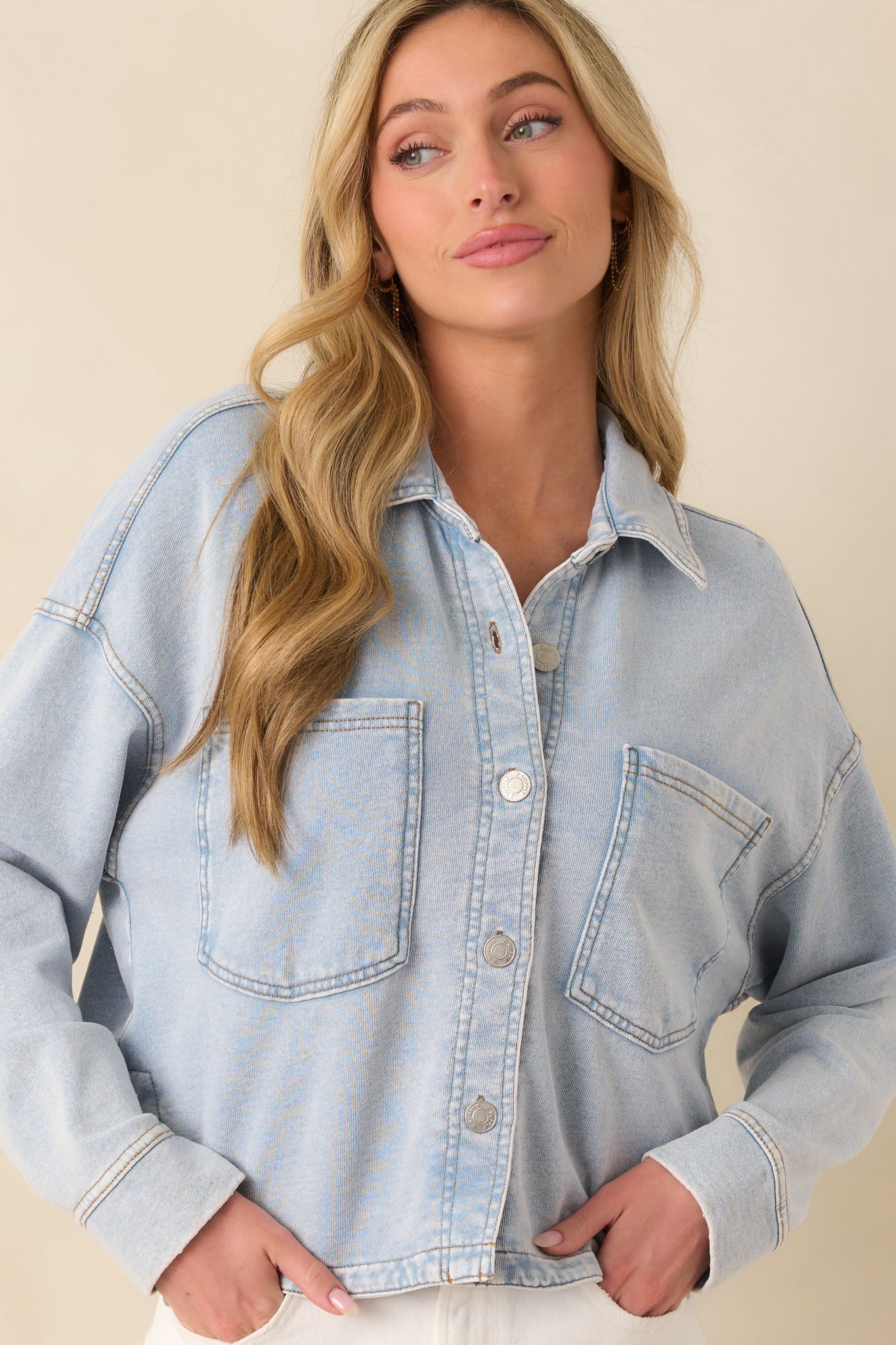 A cropped detail of the upper chest showing the texture of the washed indigo fabric.