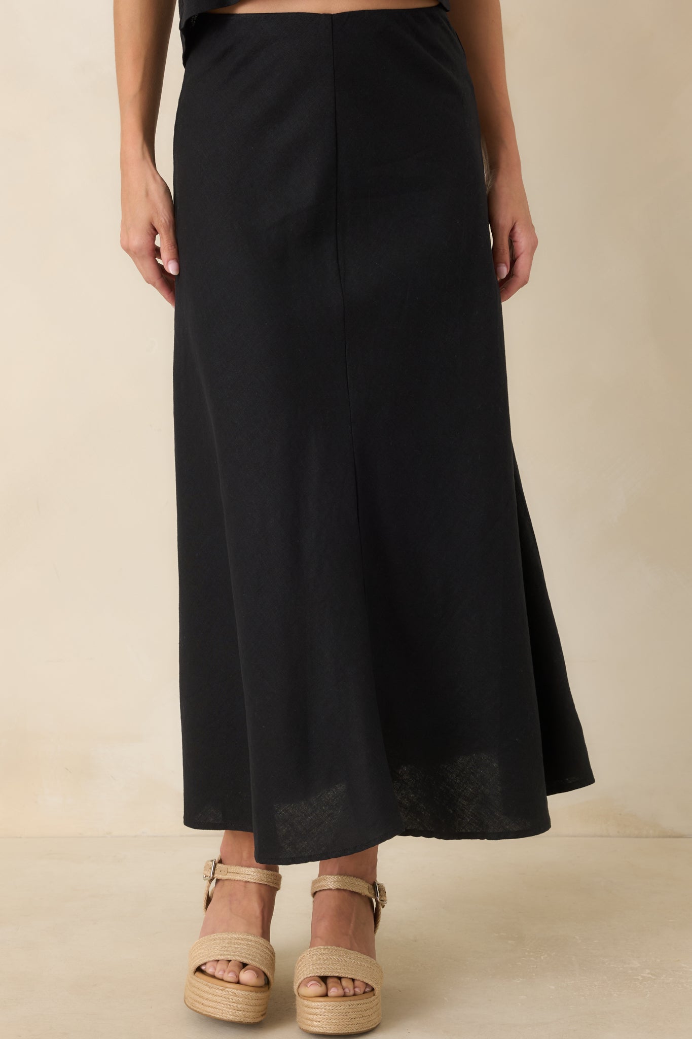 Detailed view of the washed linen-rayon fabric highlighting the soft texture and natural drape of the midi skirt.