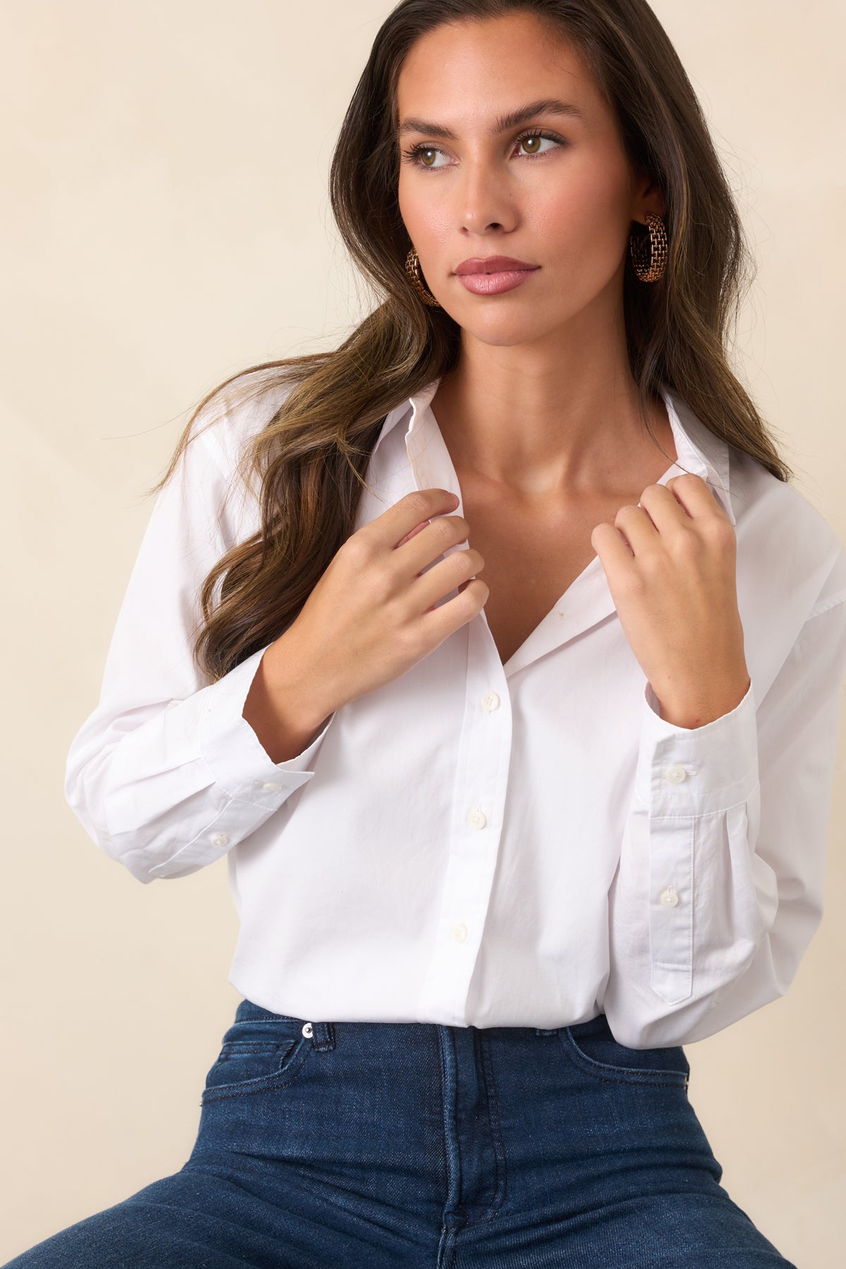 Lightweight white button-up shirt featuring a clean front placket and crisp cotton poplin fabric