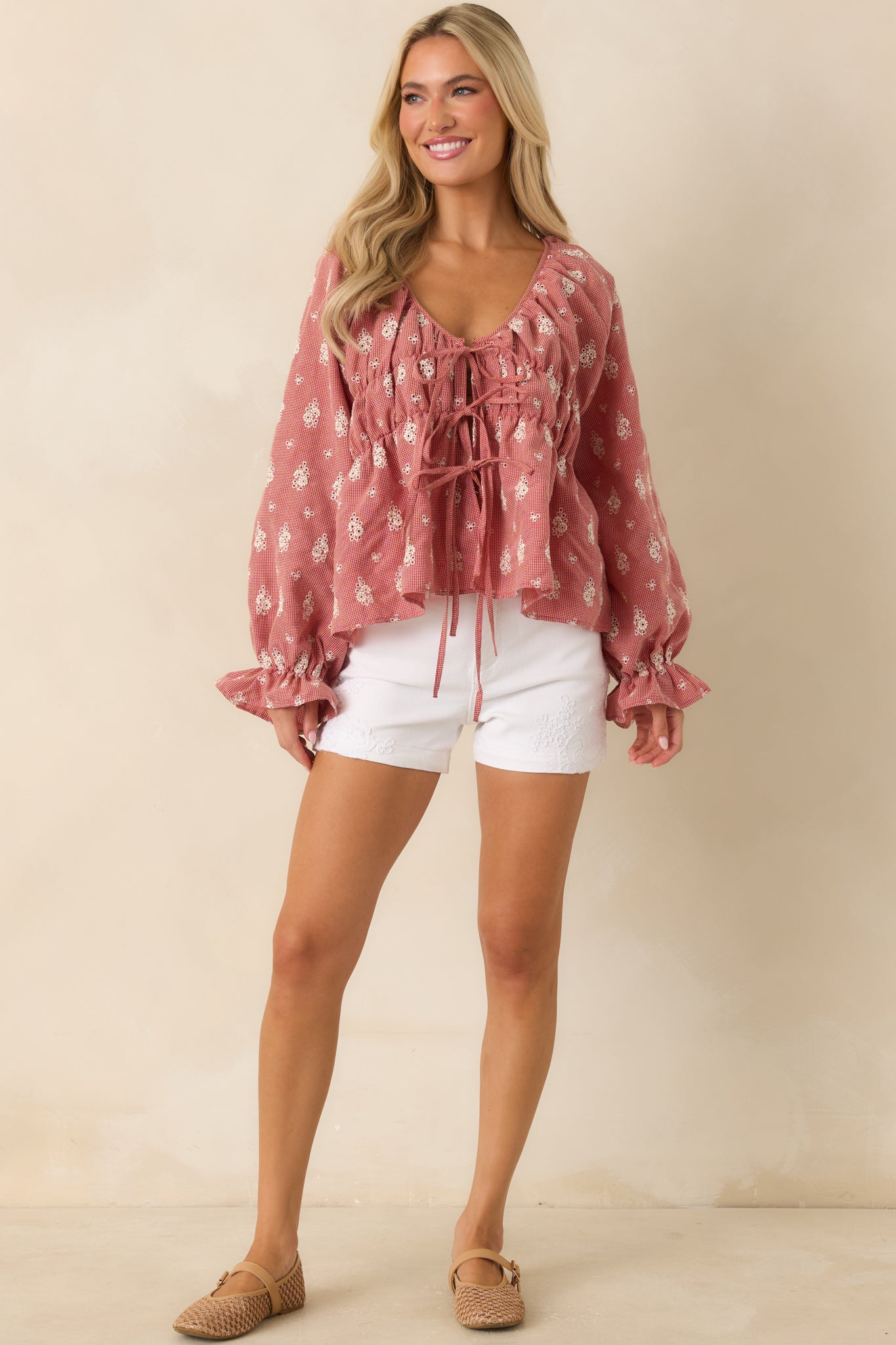 White embroidered denim shorts with classic five-pocket styling and a flattering silhouette.