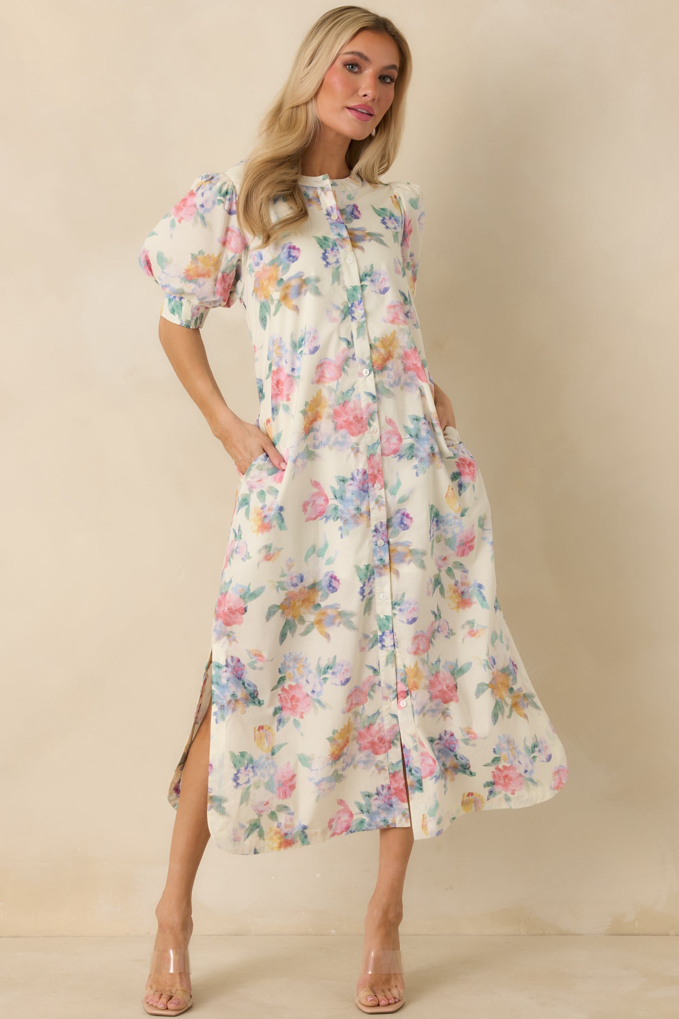 Flowing white multi maxi dress with button-front closure, relaxed silhouette, and side slits for easy movement.