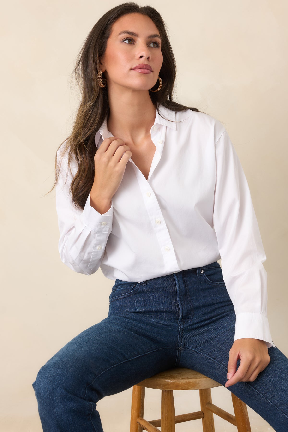 White cotton poplin shirt highlighting the classic collar and full front button closure.