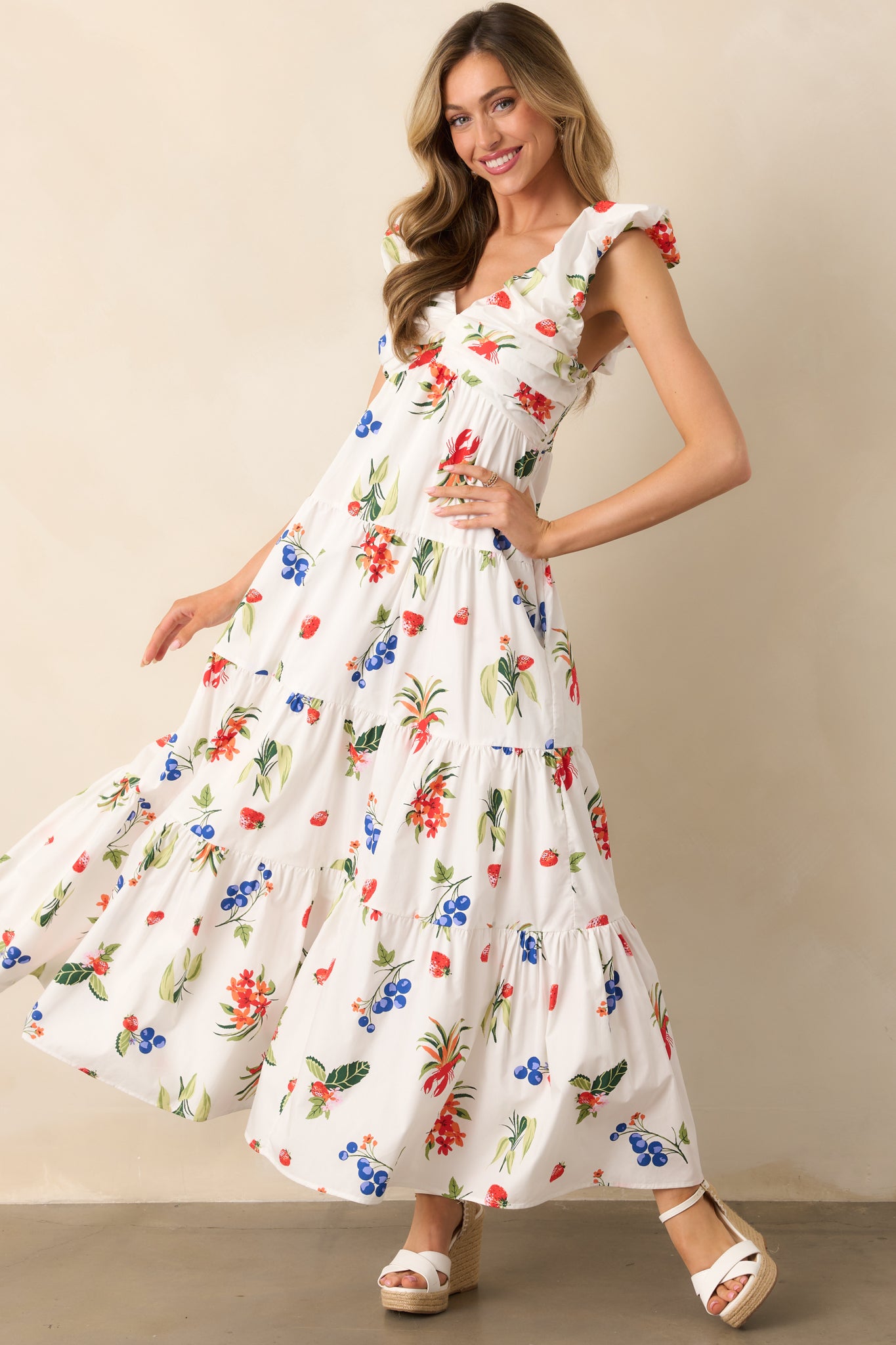 The airy white dress showcases its functional pockets and tiered design, adding both style and convenience.