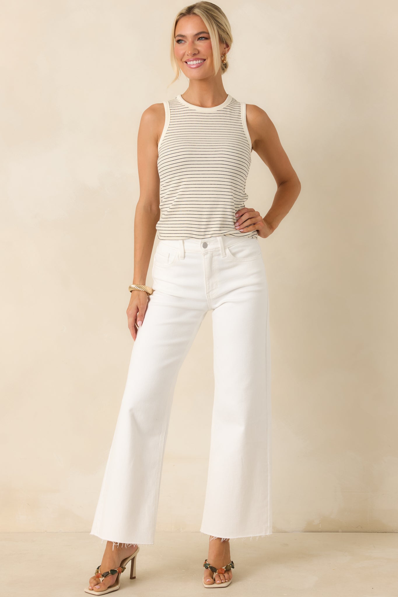 White wide-leg jeans with functional pockets, unfinished hems, and a clean everyday design.