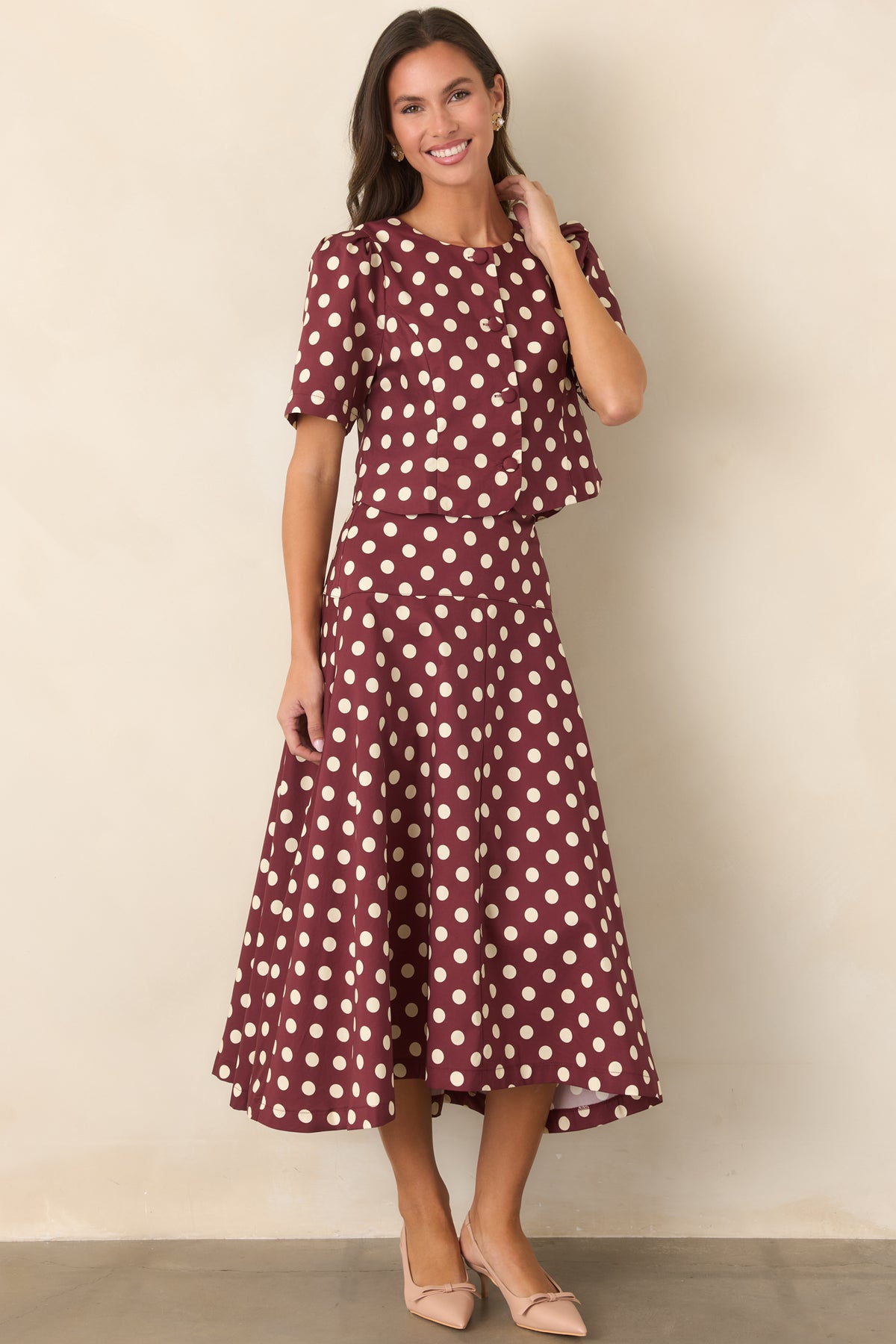 Wine and ivory dotted midi skirt with a wide fitted yoke and flowing skirt.