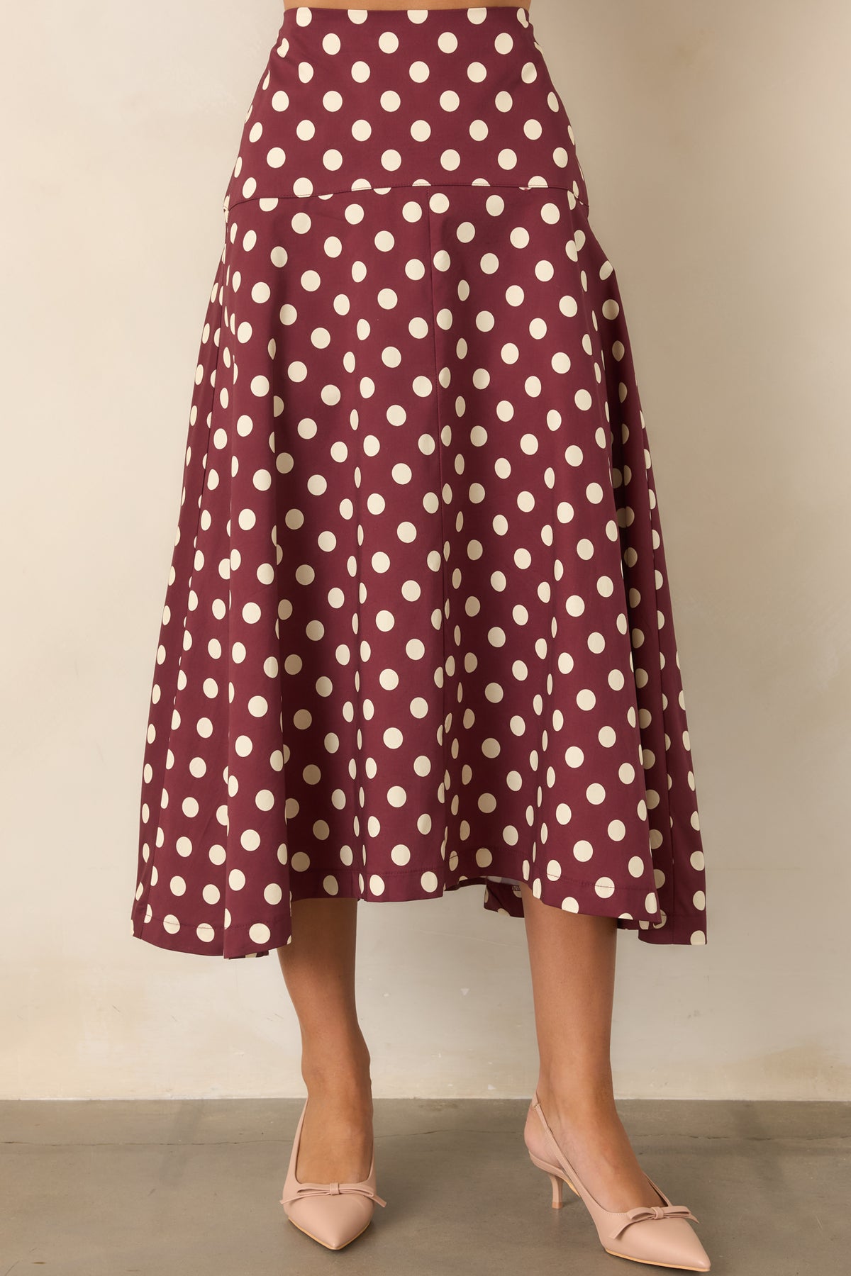 Wine cotton skirt with an ivory dotted print and wide fitted yoke defining the waist.