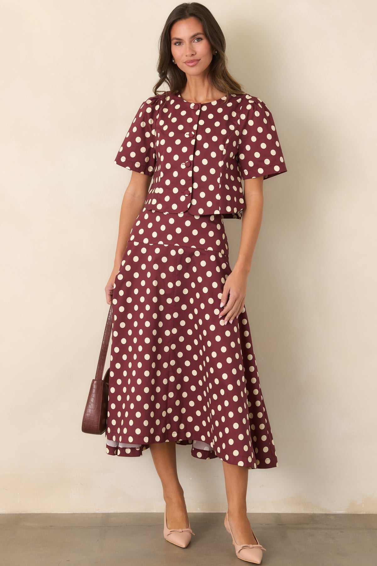 Rich wine midi skirt featuring an ivory dot pattern and full flared silhouette.