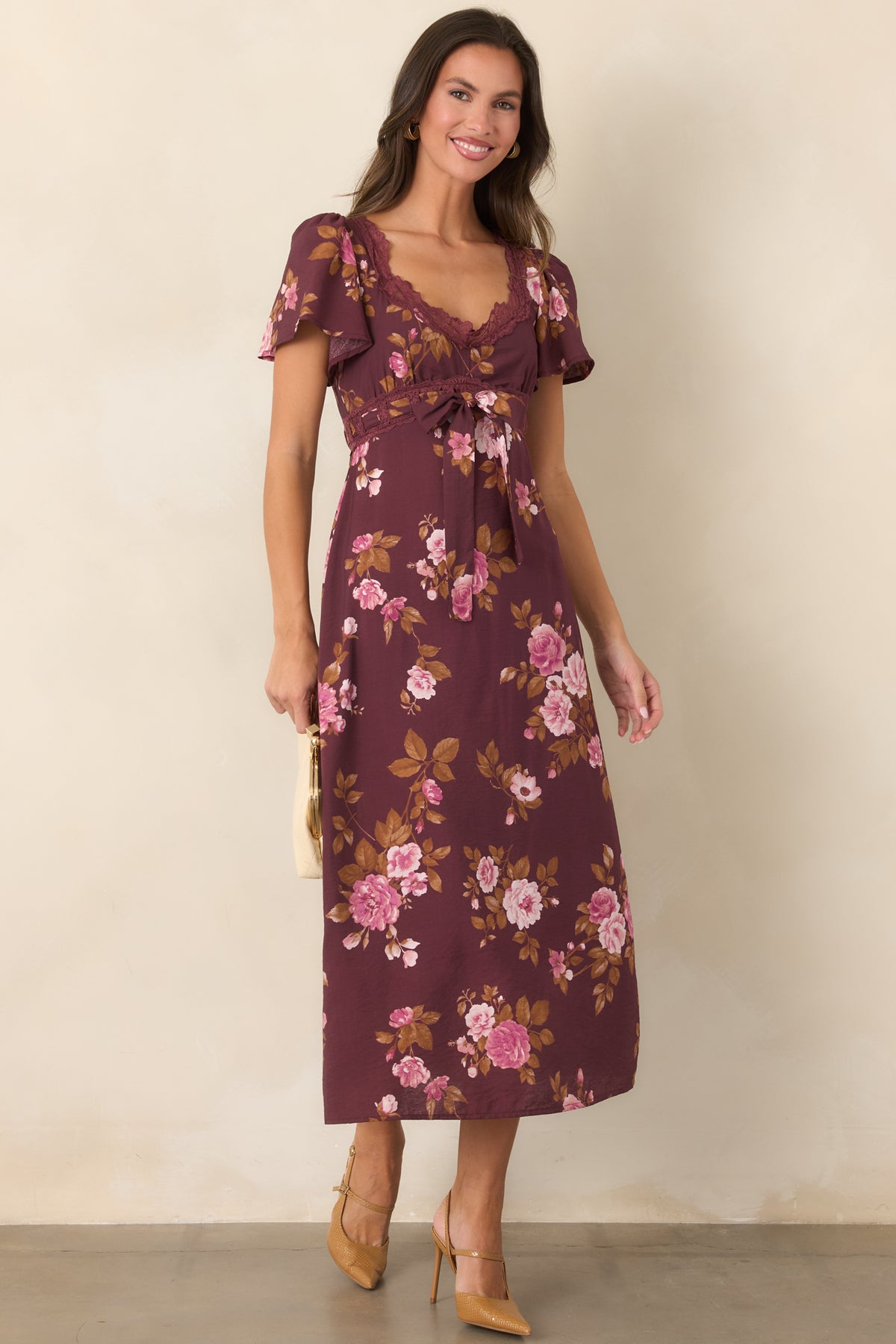 Floral midi dress in rich wine with short flutter sleeves, scalloped lace trim, and a gently gathered bodice.