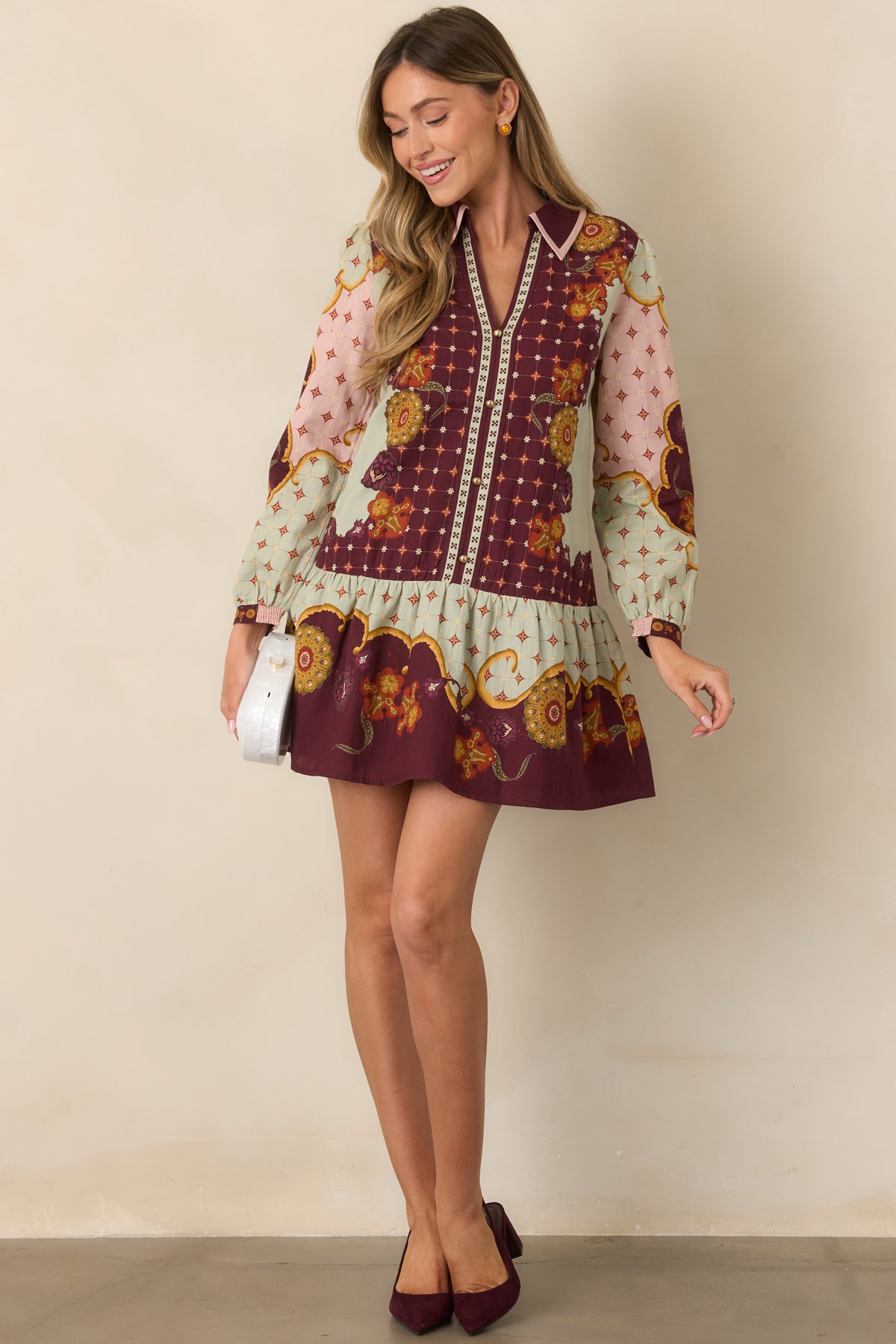 Relaxed mini dress featuring ornate florals in pale sage, blush pink, mustard gold, and rust.