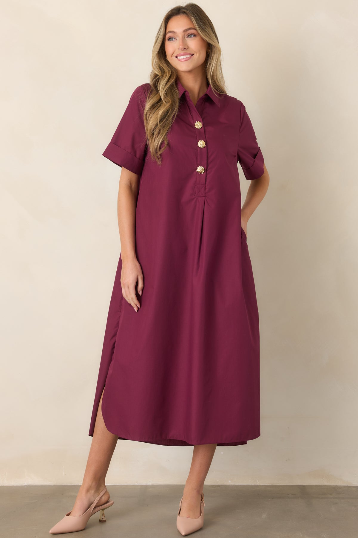 Elegant woven maxi dress highlighting its classic collar, rolled short sleeves, relaxed silhouette, and side slits for effortless movement.