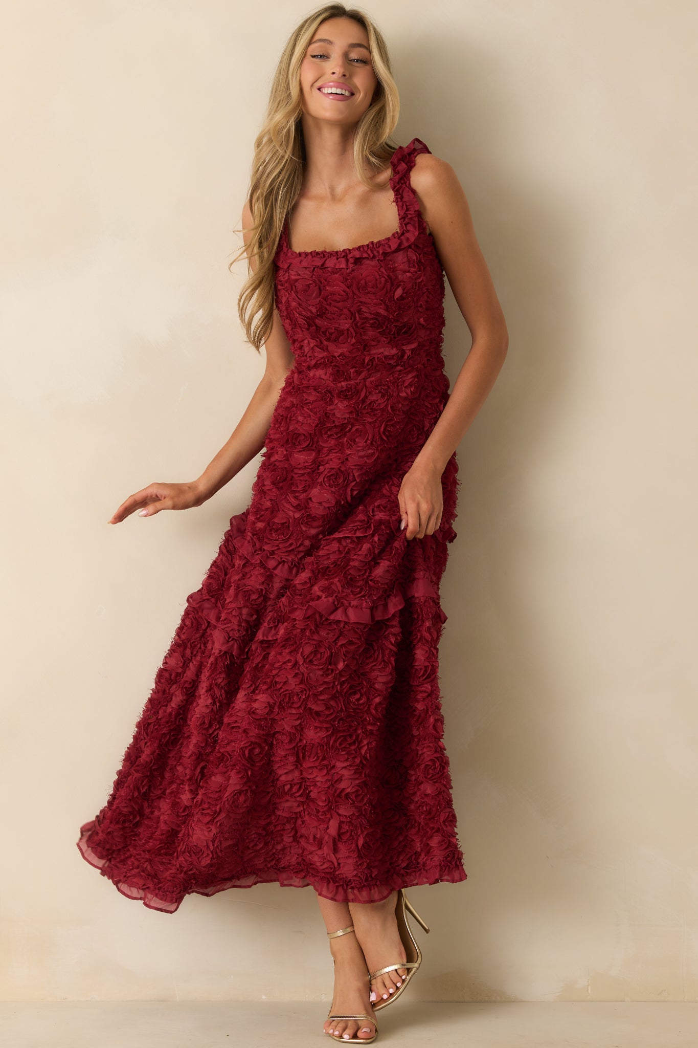 Wine red design featuring cascading ruffles along the skirt hem.