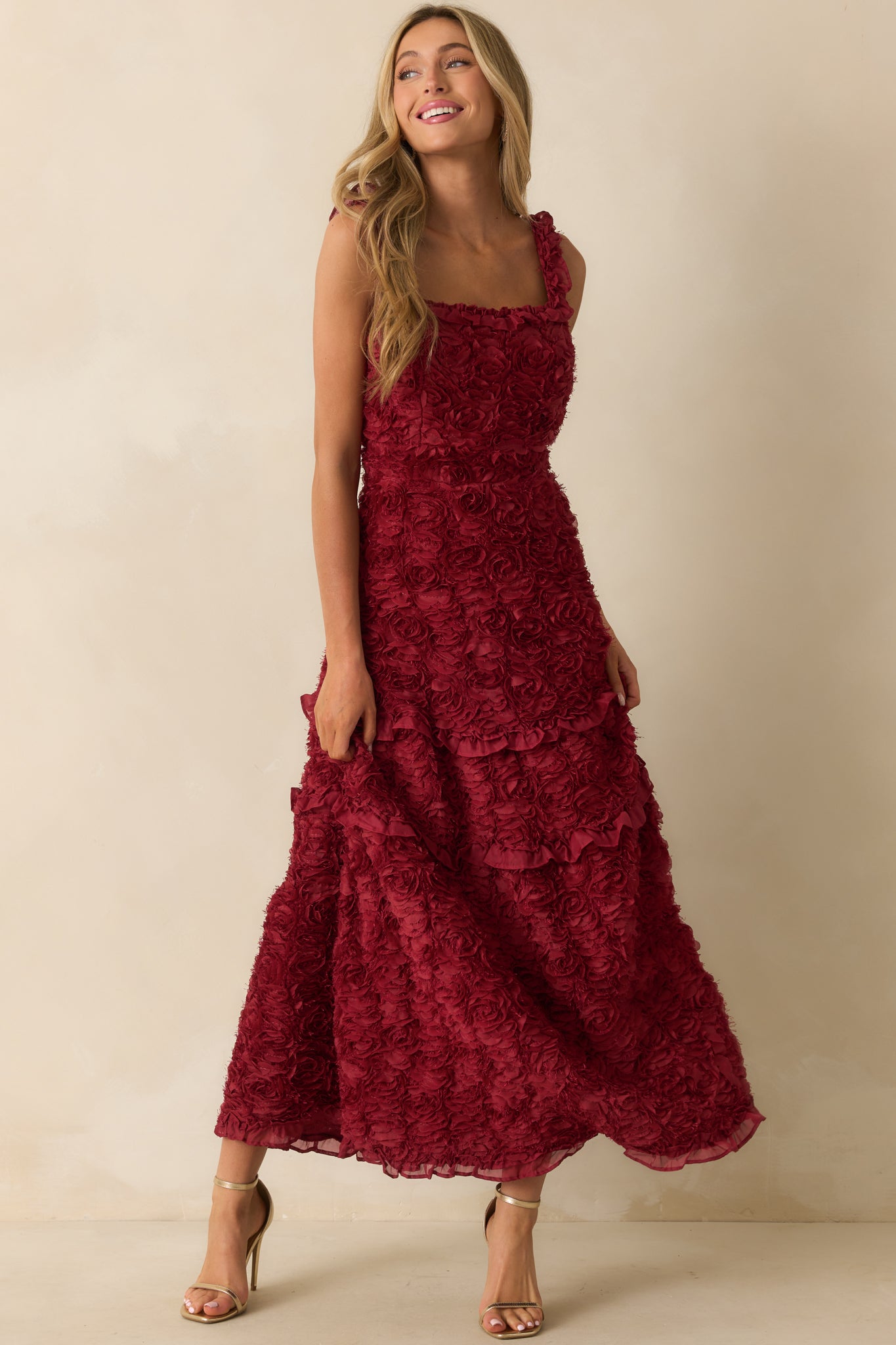 Wine red dress with a square neckline and tiered ruffle skirt.