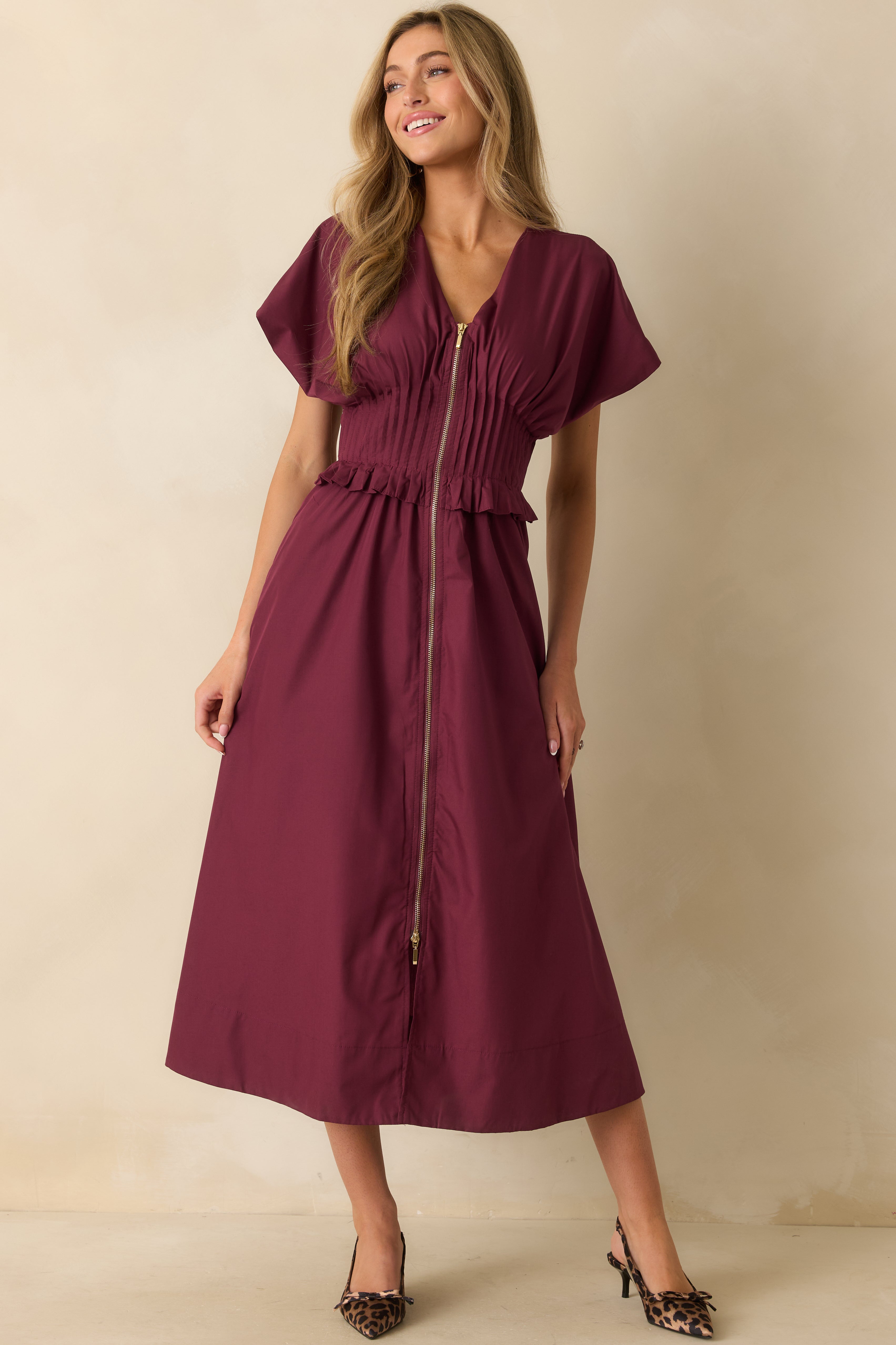 Front view of wine red woven maxi dress showing the V-neckline and relaxed A-line skirt.