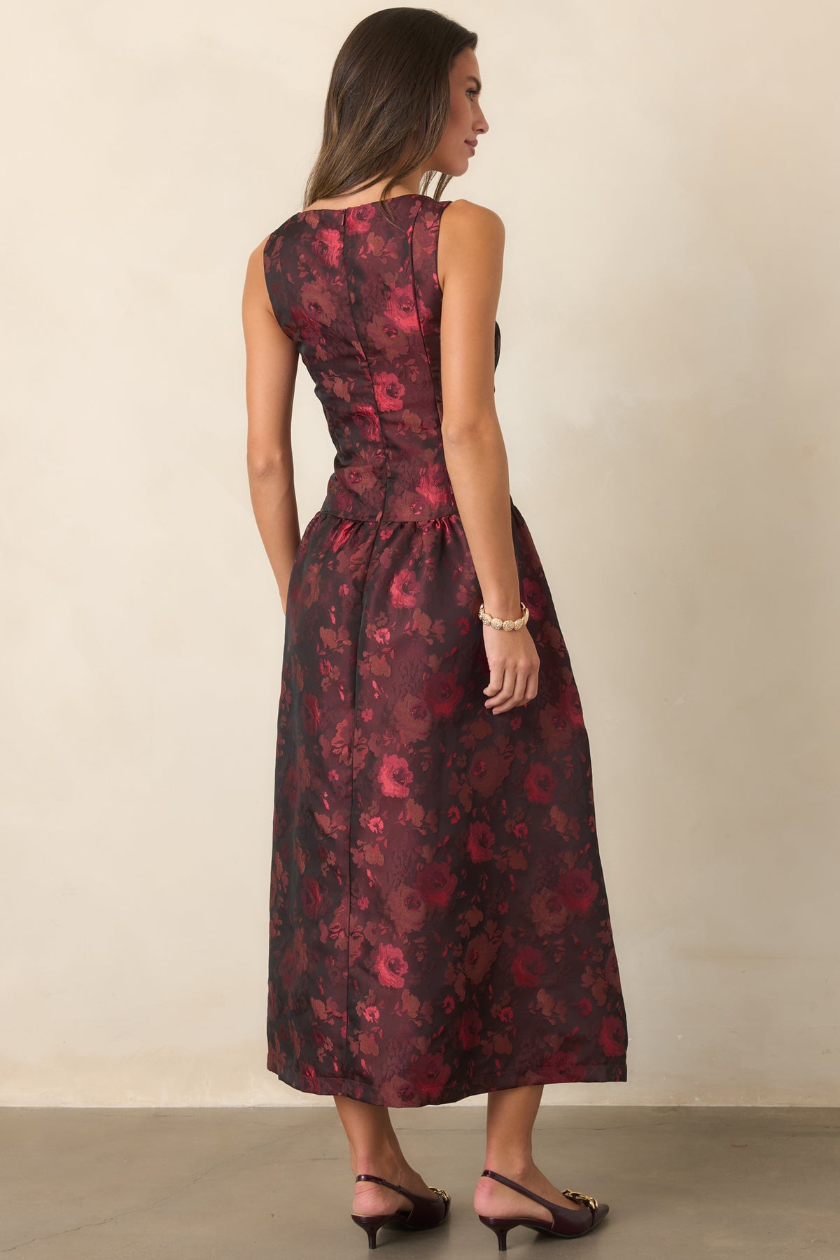 Rear of the woven floral midi dress featuring a concealed back zipper and gathered full skirt.