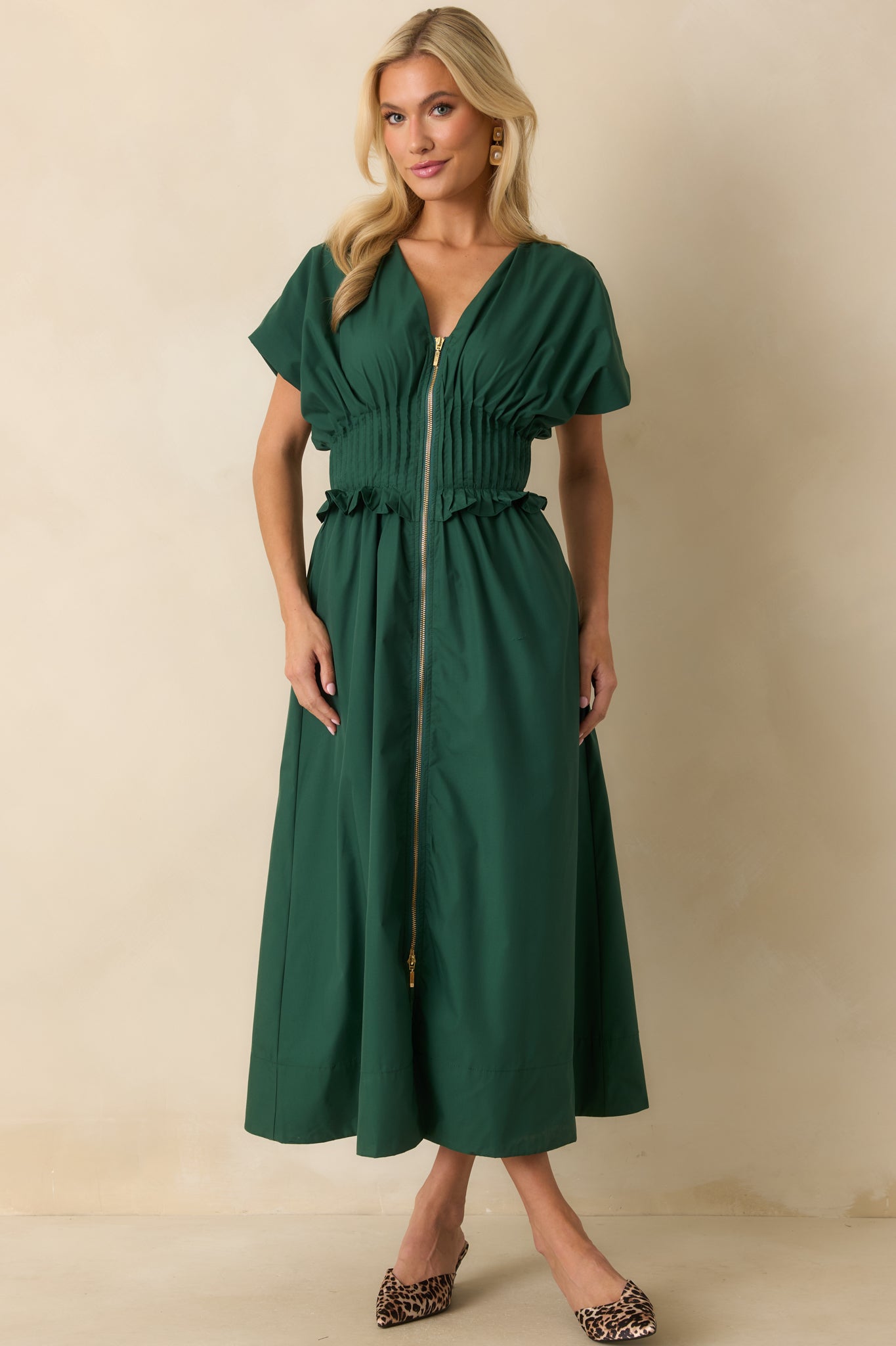 Relaxed woven maxi dress highlighting the smocked waist and soft drape of the skirt.