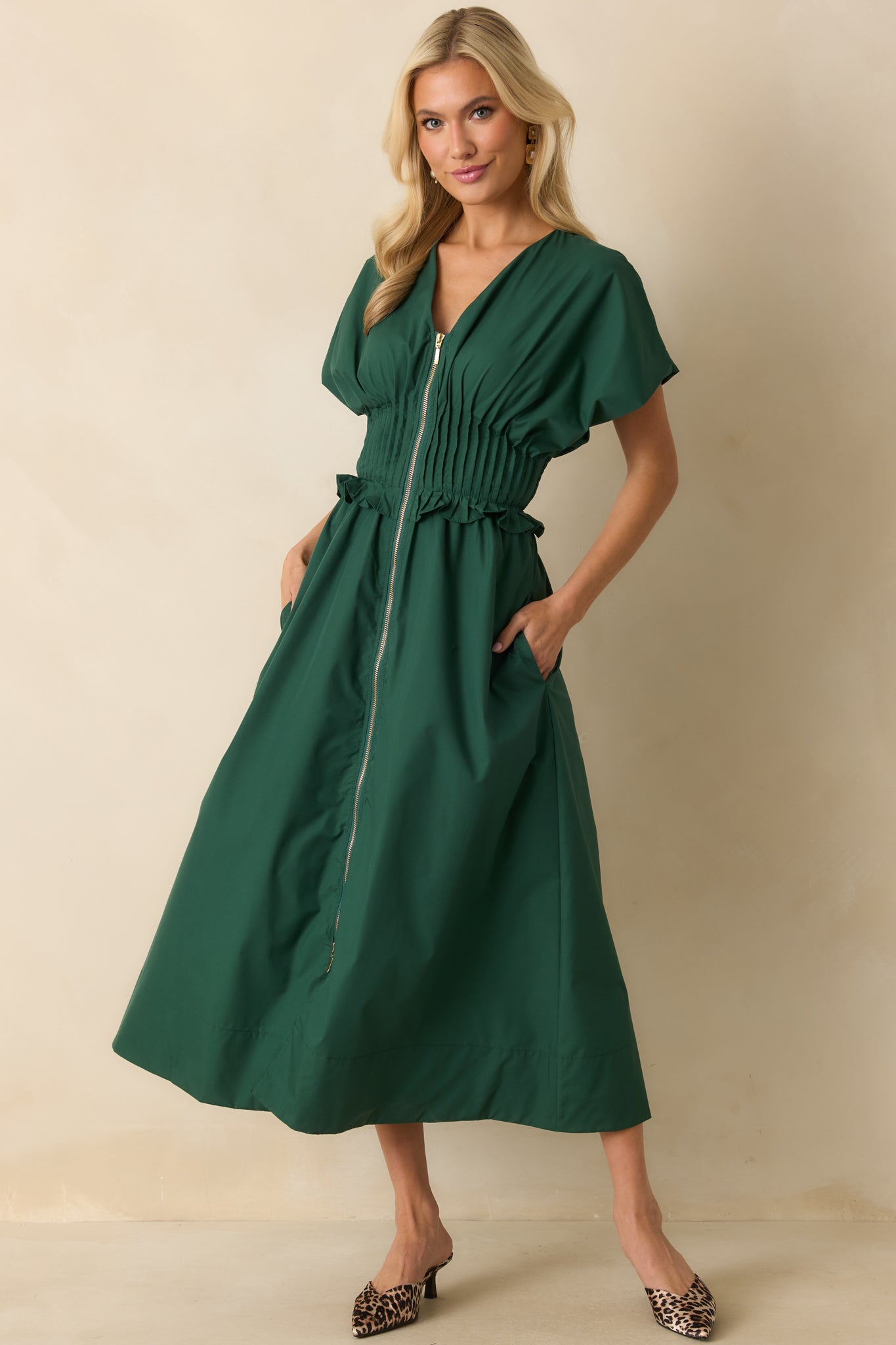 Woven maxi dress with a V-neckline and smocked waistband showing its flowing A-line silhouette.