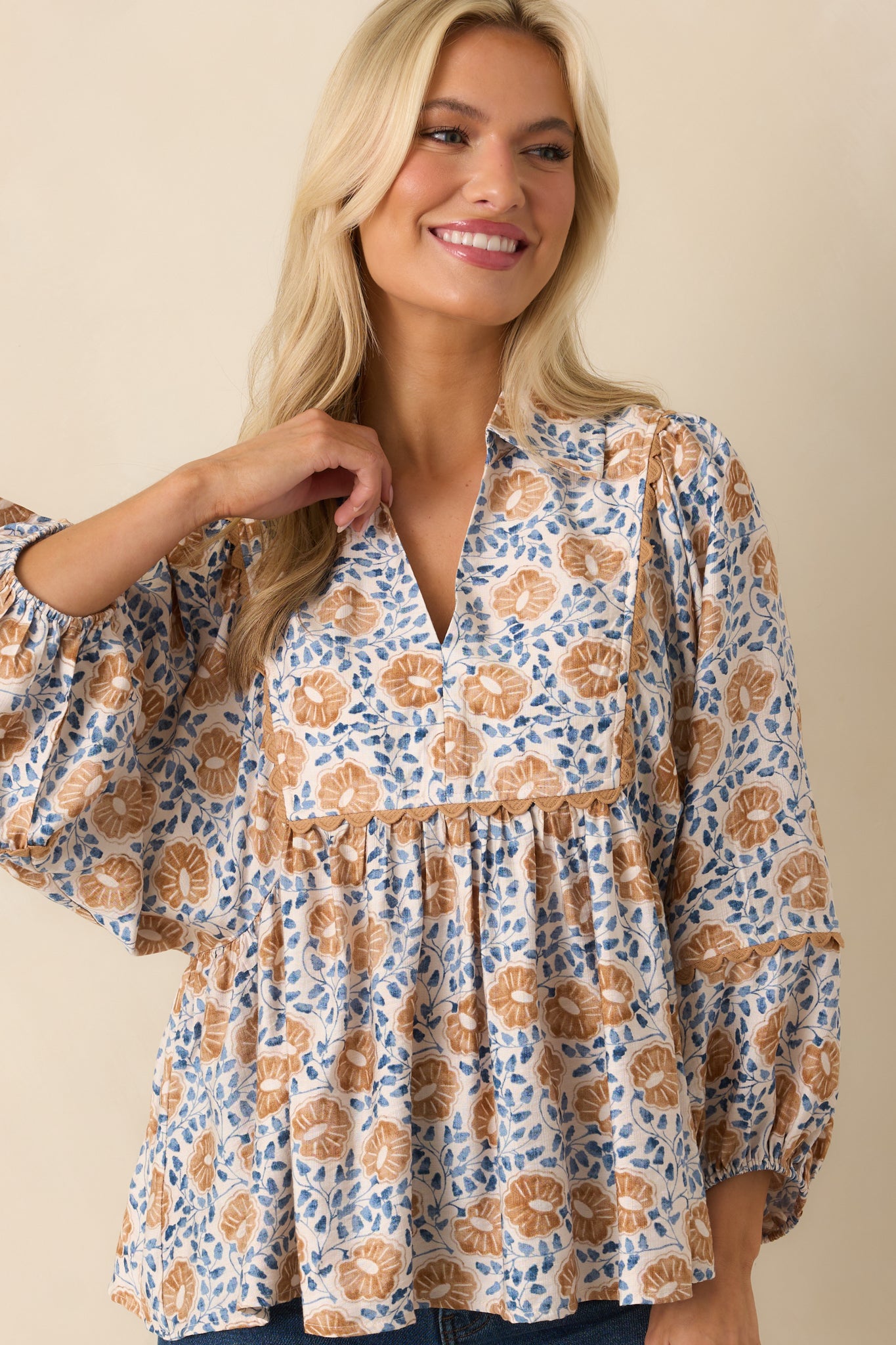 Cropped image centered on the yoke and upper chest, highlighting the yellow trim against the floral print.