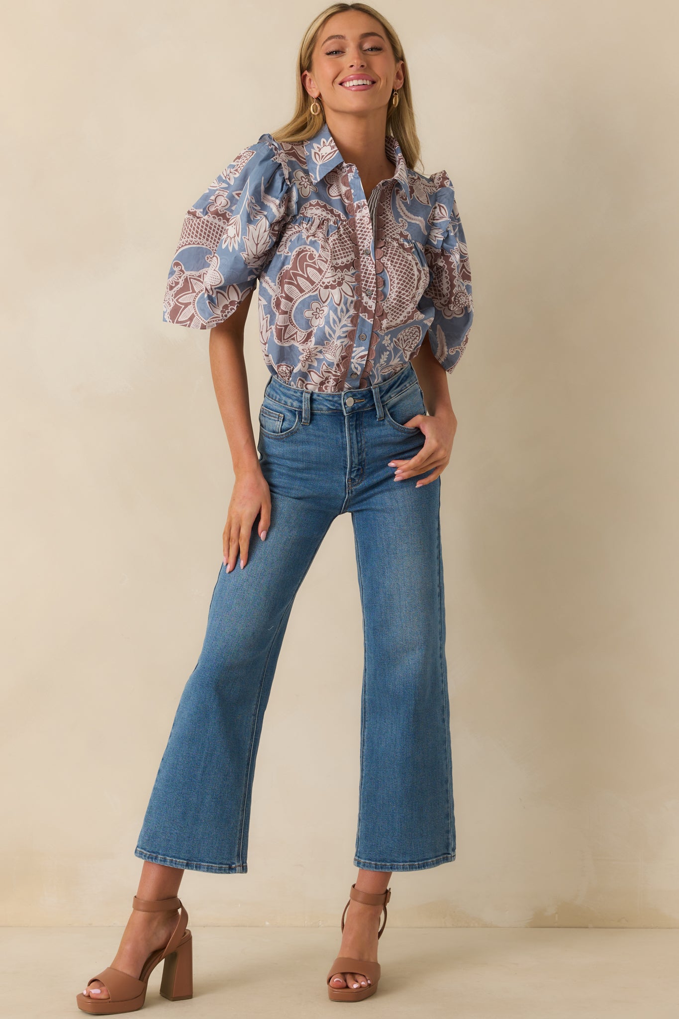 Ash blue and mauve paisley floral blouse with collared neckline and ruffle trim accents.