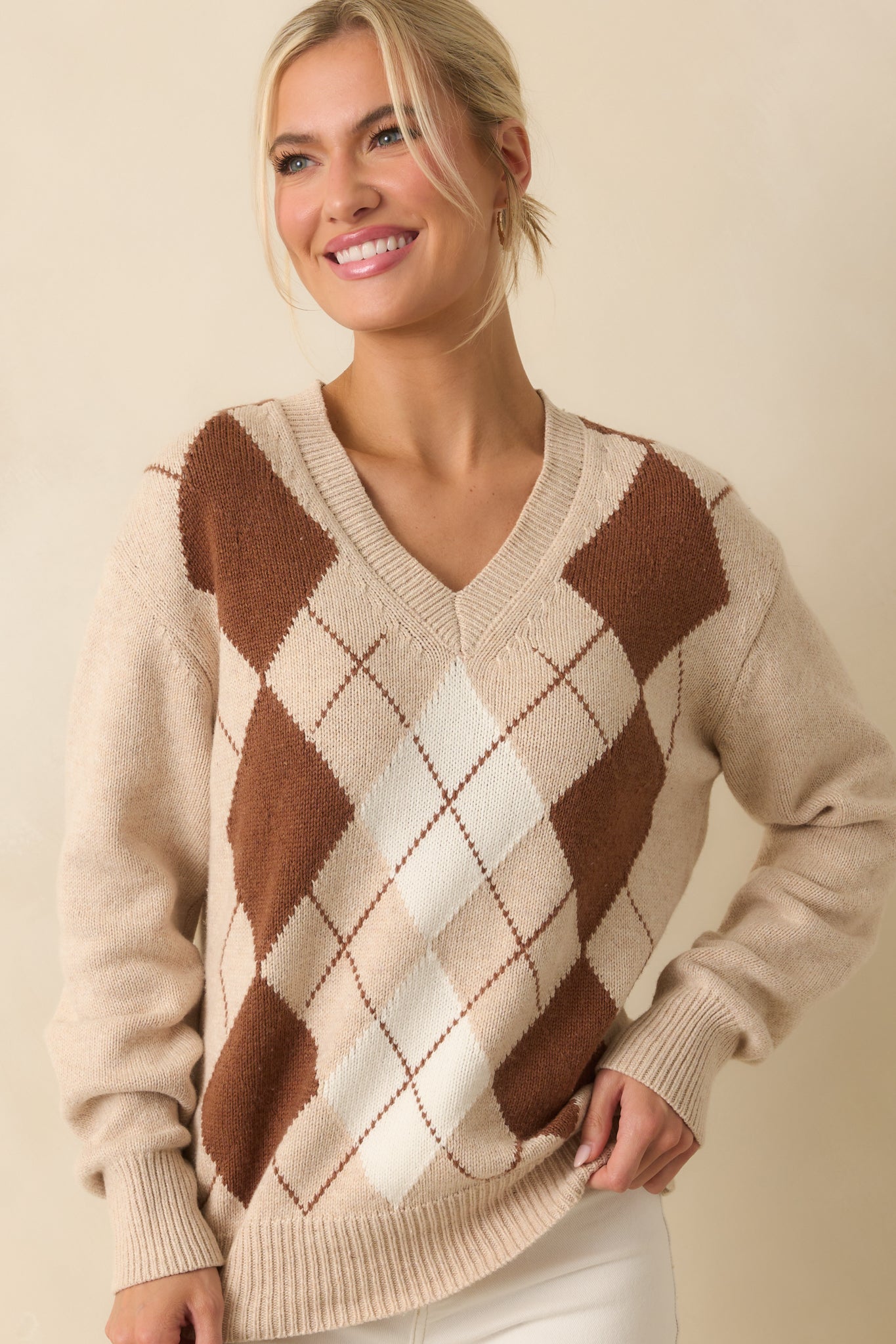 Cropped view emphasizing the relaxed fit and argyle design across the chest.