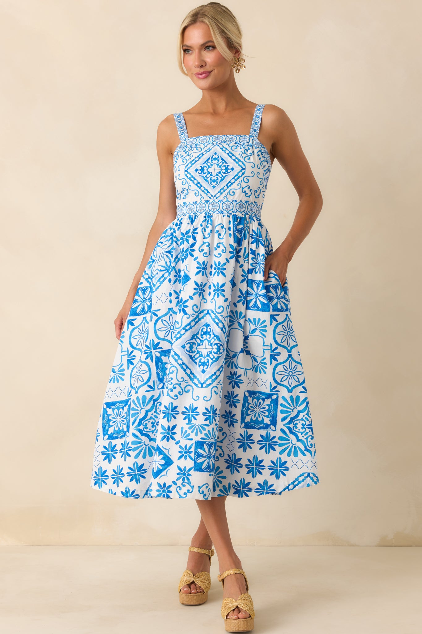 Full body view focusing on the clean vertical lines of the tile print and the natural drape of the midi-length skirt.