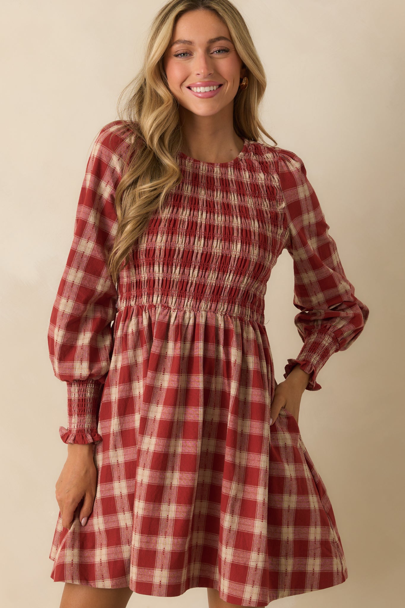 Smocked bodice in brick red gingham with neat ruching detail.