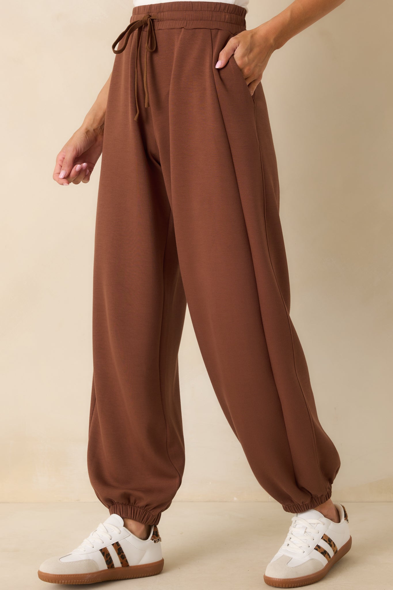 Cropped photo highlighting the side hip pocket and smooth fabric.