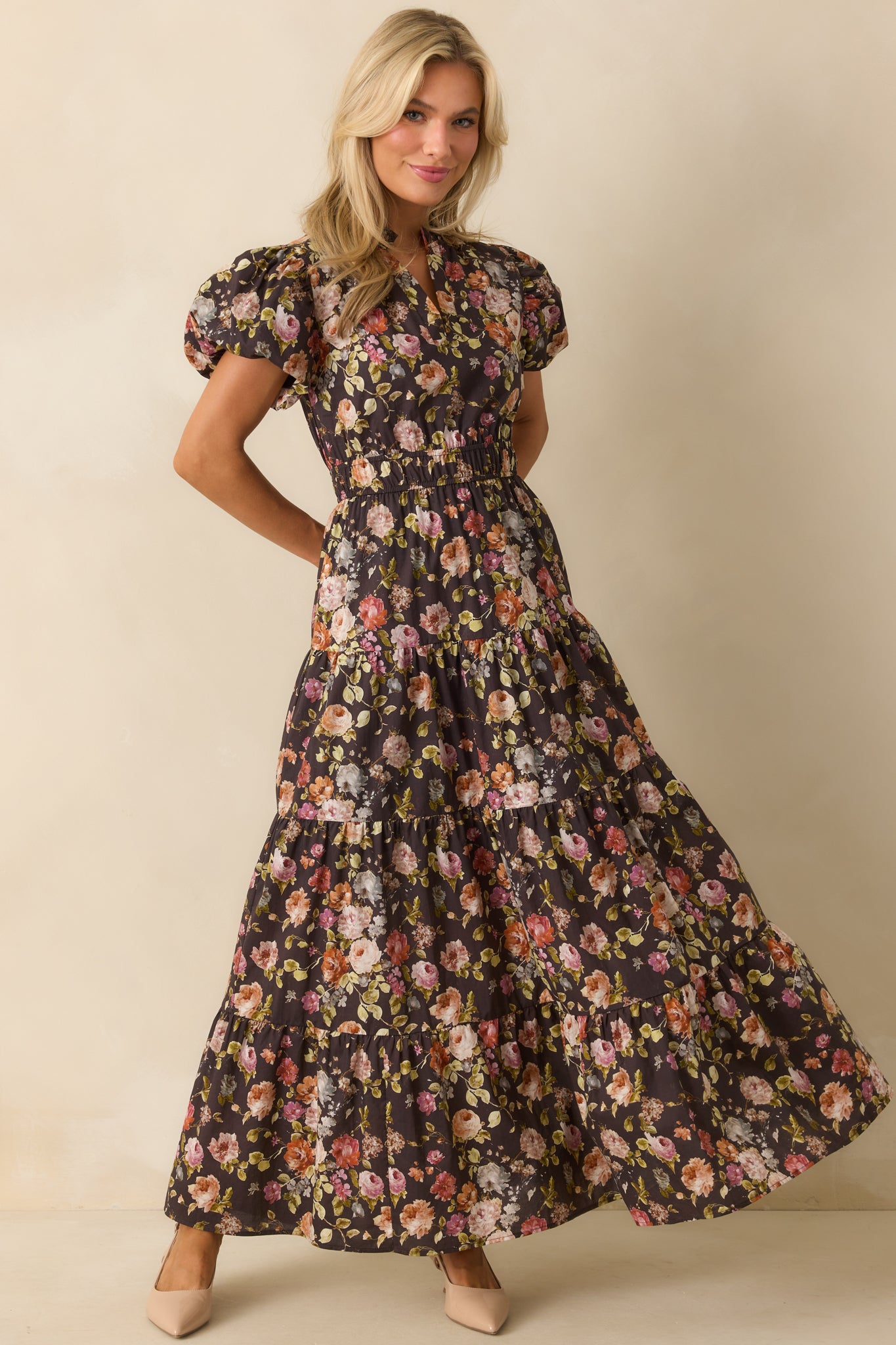 Floral maxi dress with a cinched waist and airy tiered silhouette.