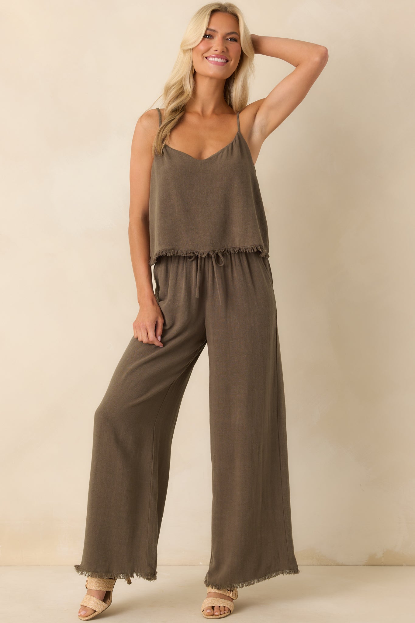 Full body front view of the tiki brown pants showing the wide leg silhouette and high rise waist.