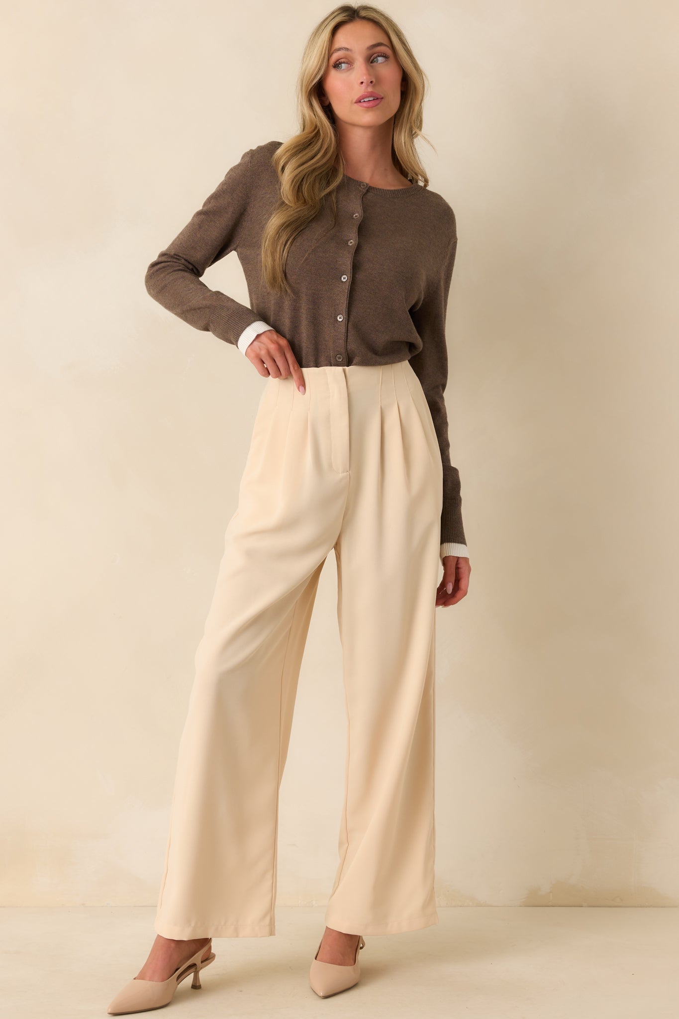 Full body front view of the brown cardigan displaying the crew neckline, button front, and long sleeves.