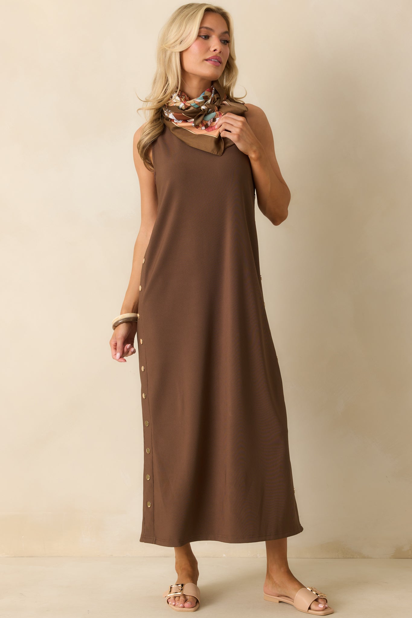 Front-facing shot emphasizing the gold button side details and flowing maxi length.