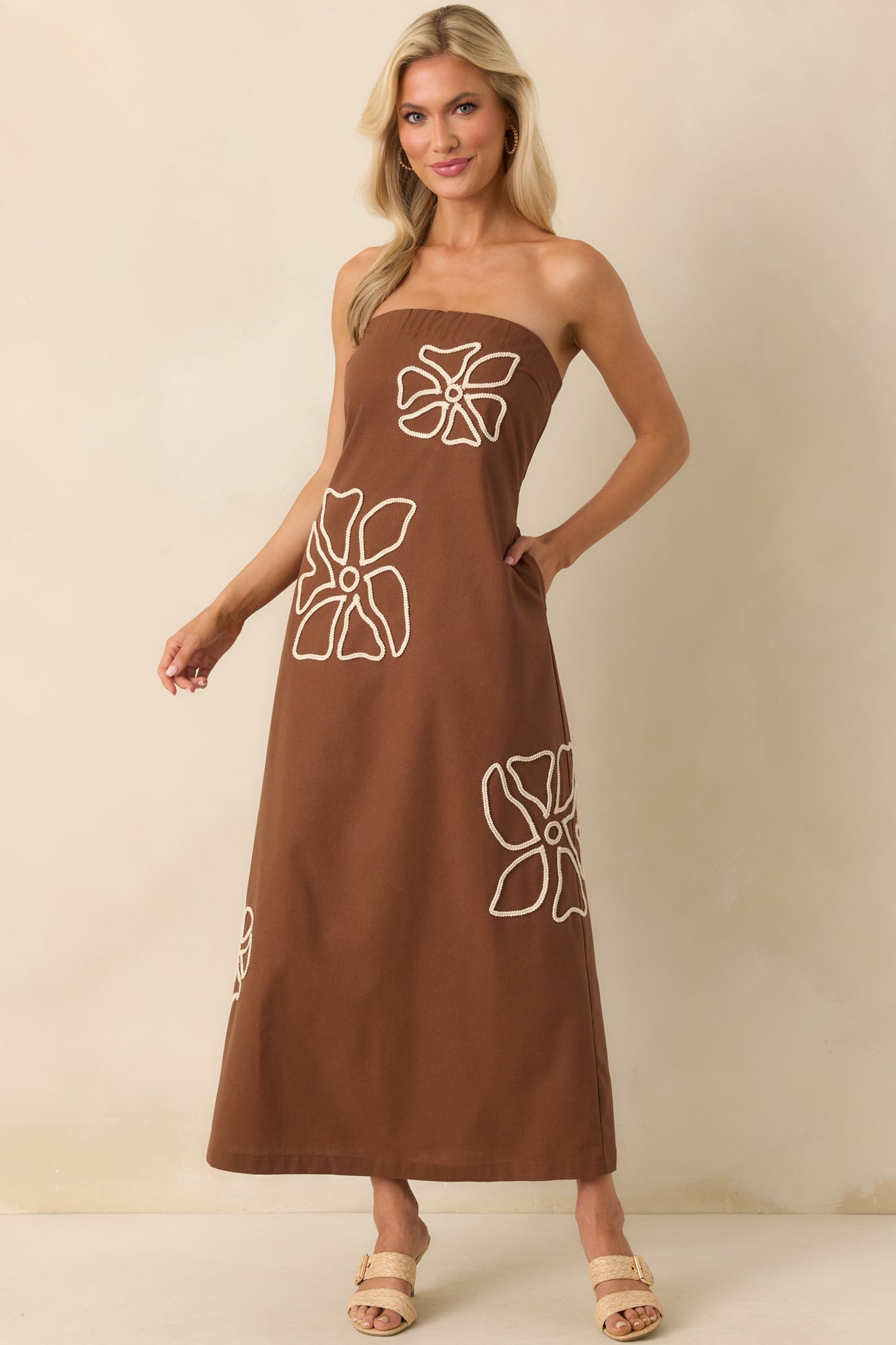 Full body front view of the brown midi dress showcasing the ivory braided floral embroidery across the linen blend fabric.