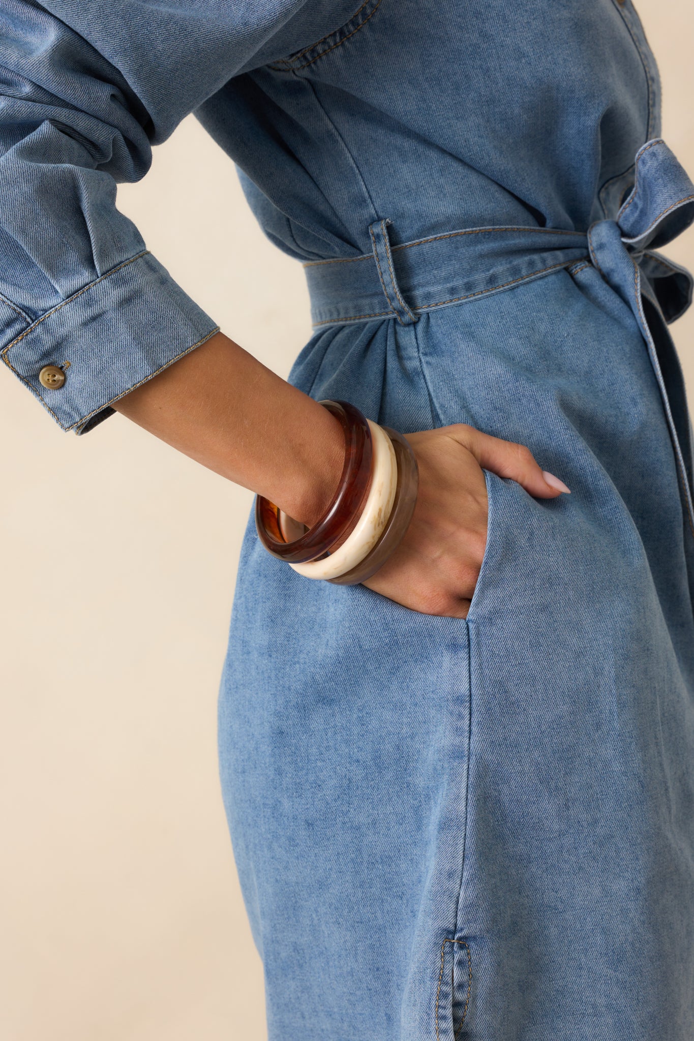 A cropped view of the bracelet set stacked together showing all three marbled designs.
