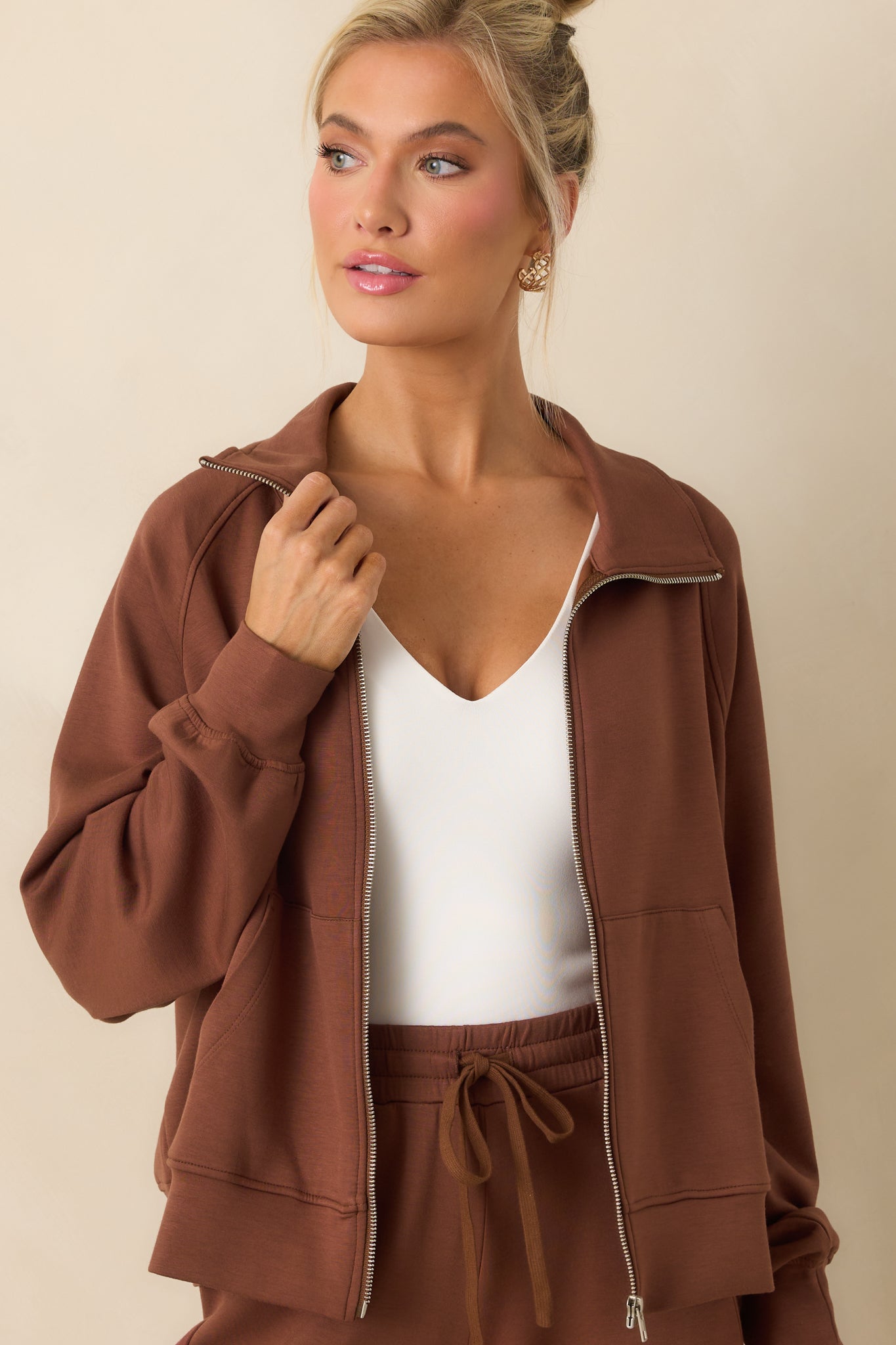 Cropped photo showing the texture and stitching along the jacket front.