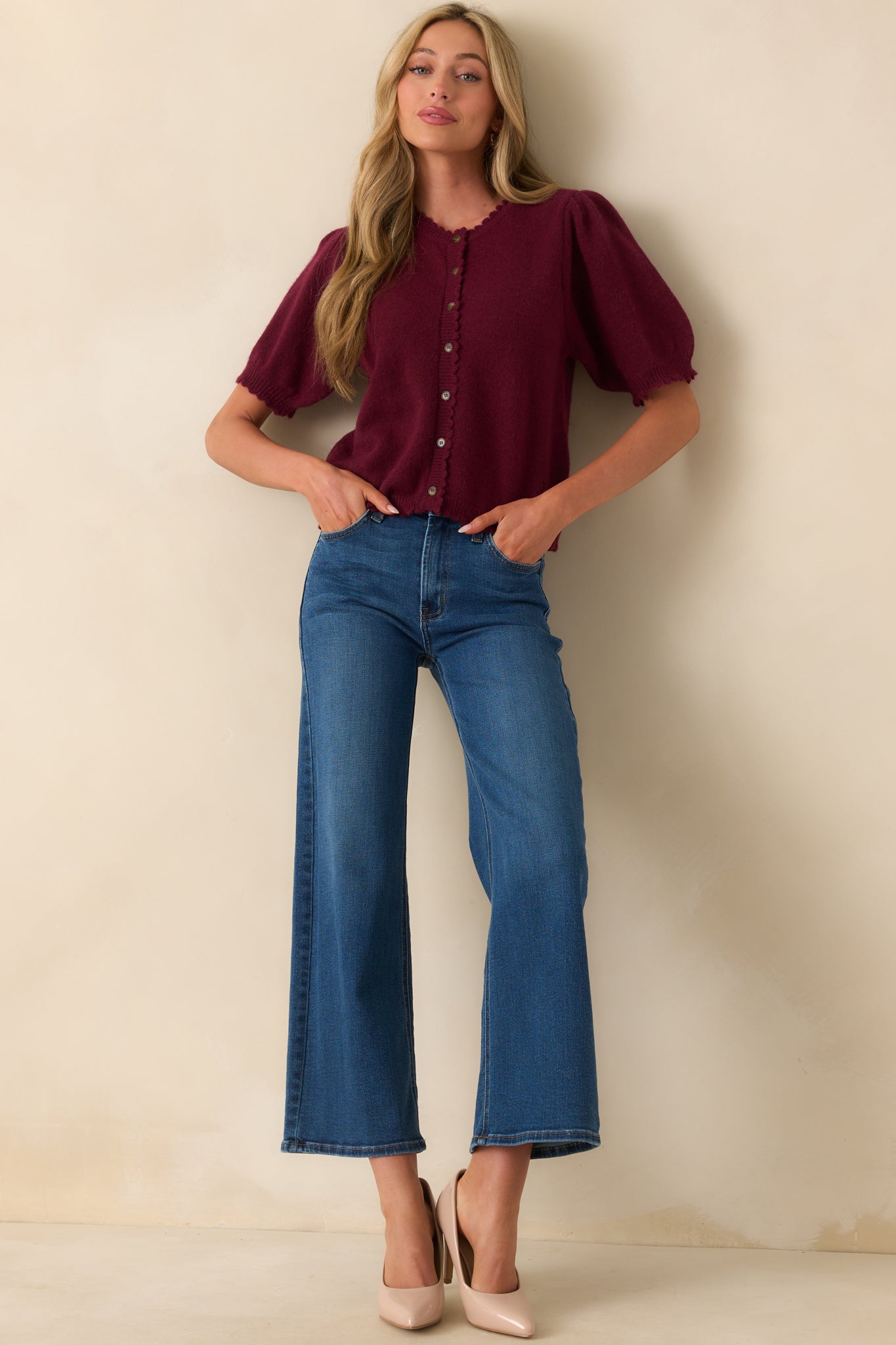 Straight-on full body image emphasizing the ribbed hems and slightly relaxed fit of the cardigan