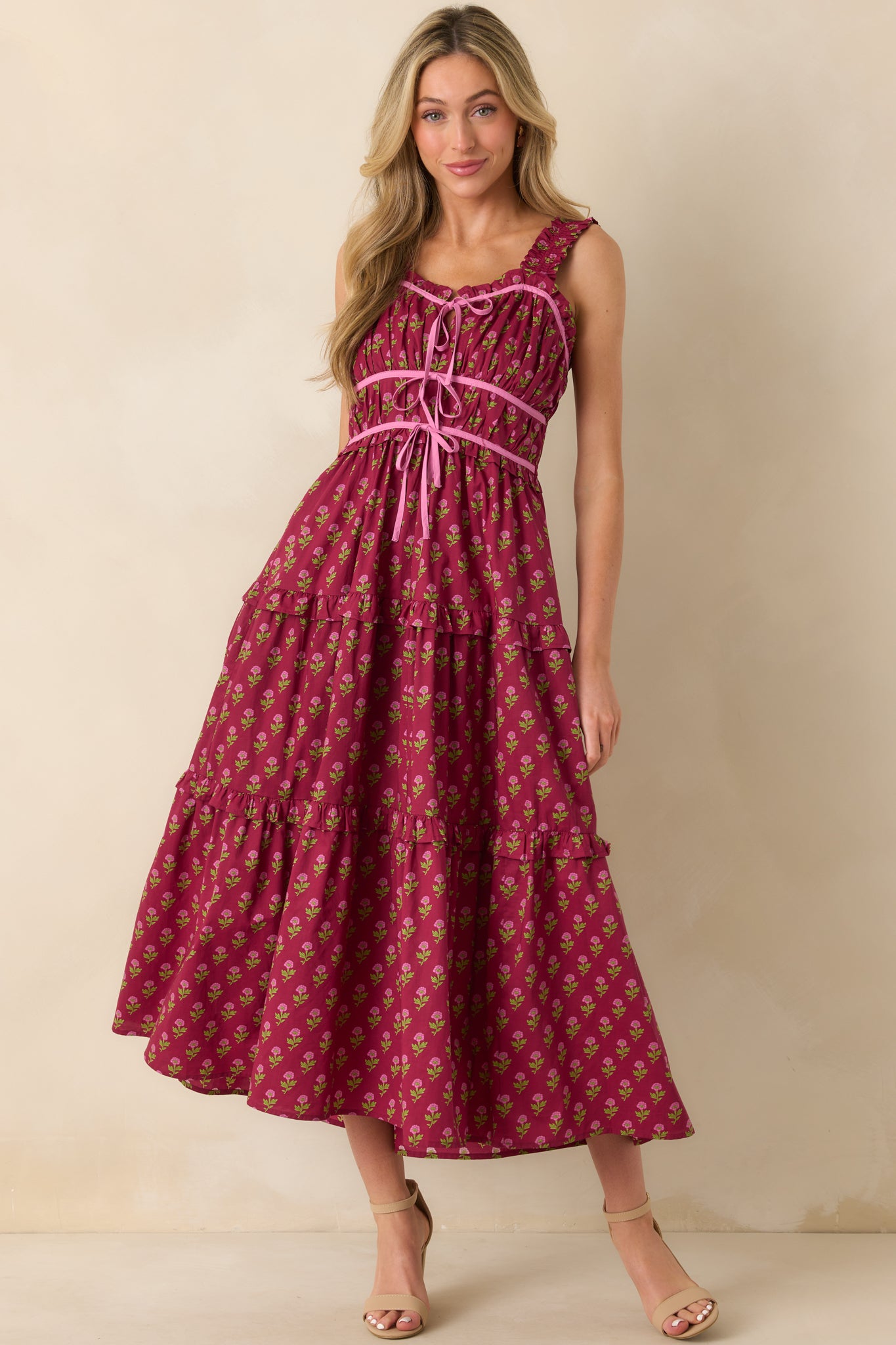 Full body shot emphasizing the ruffle trim details and pink trim accents along the bodice.