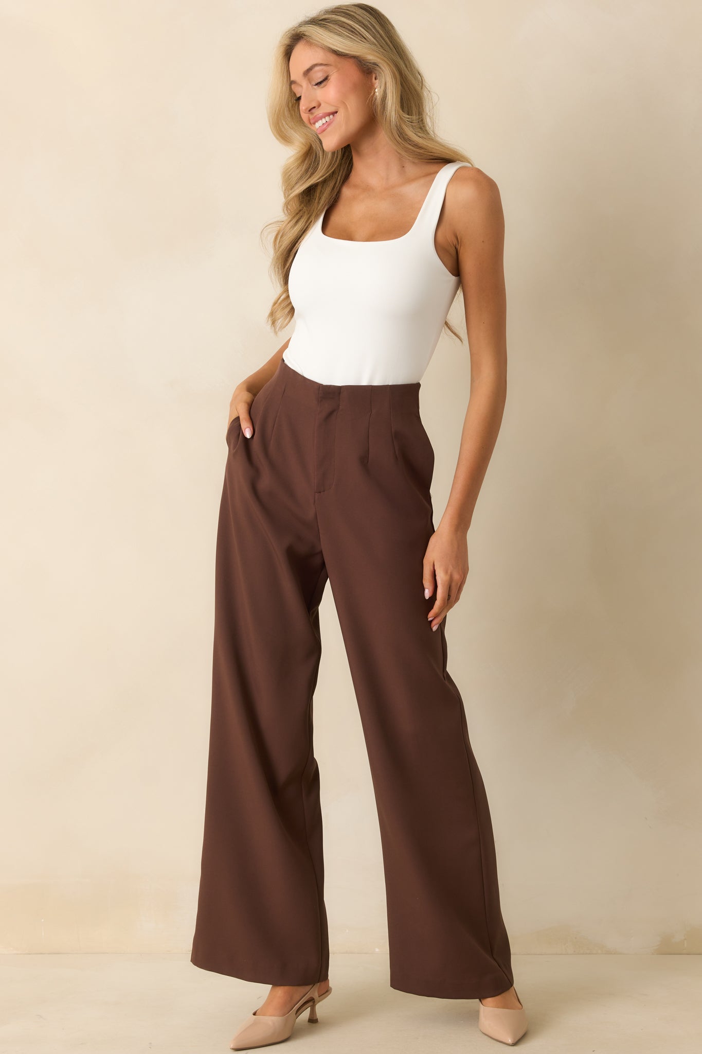 Front-facing shot of the pants highlighting the tailored silhouette and functional side pockets.