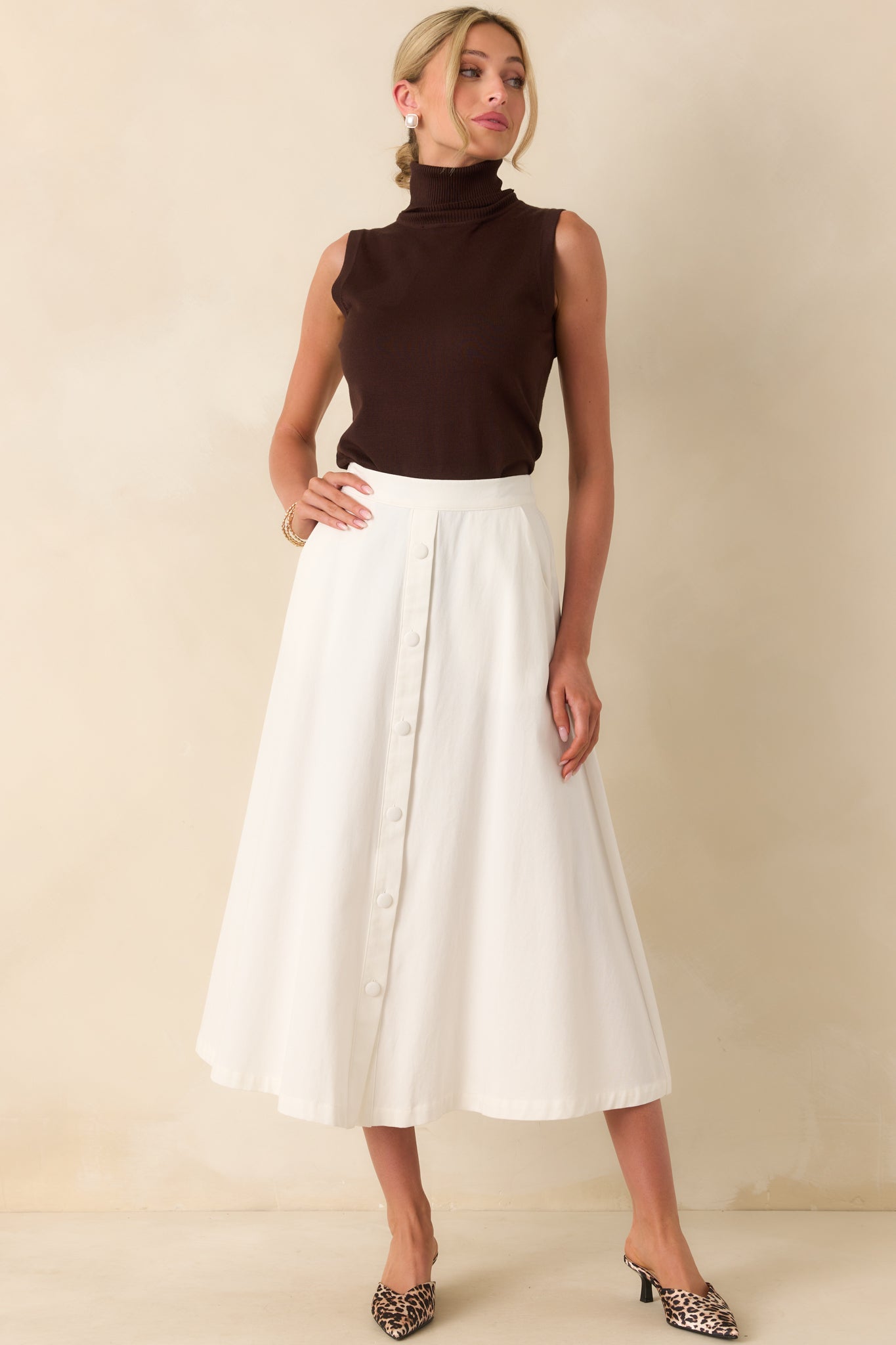 Front full body image showing the overall slim fit, rolled neckline, and small ribbed texture throughout.