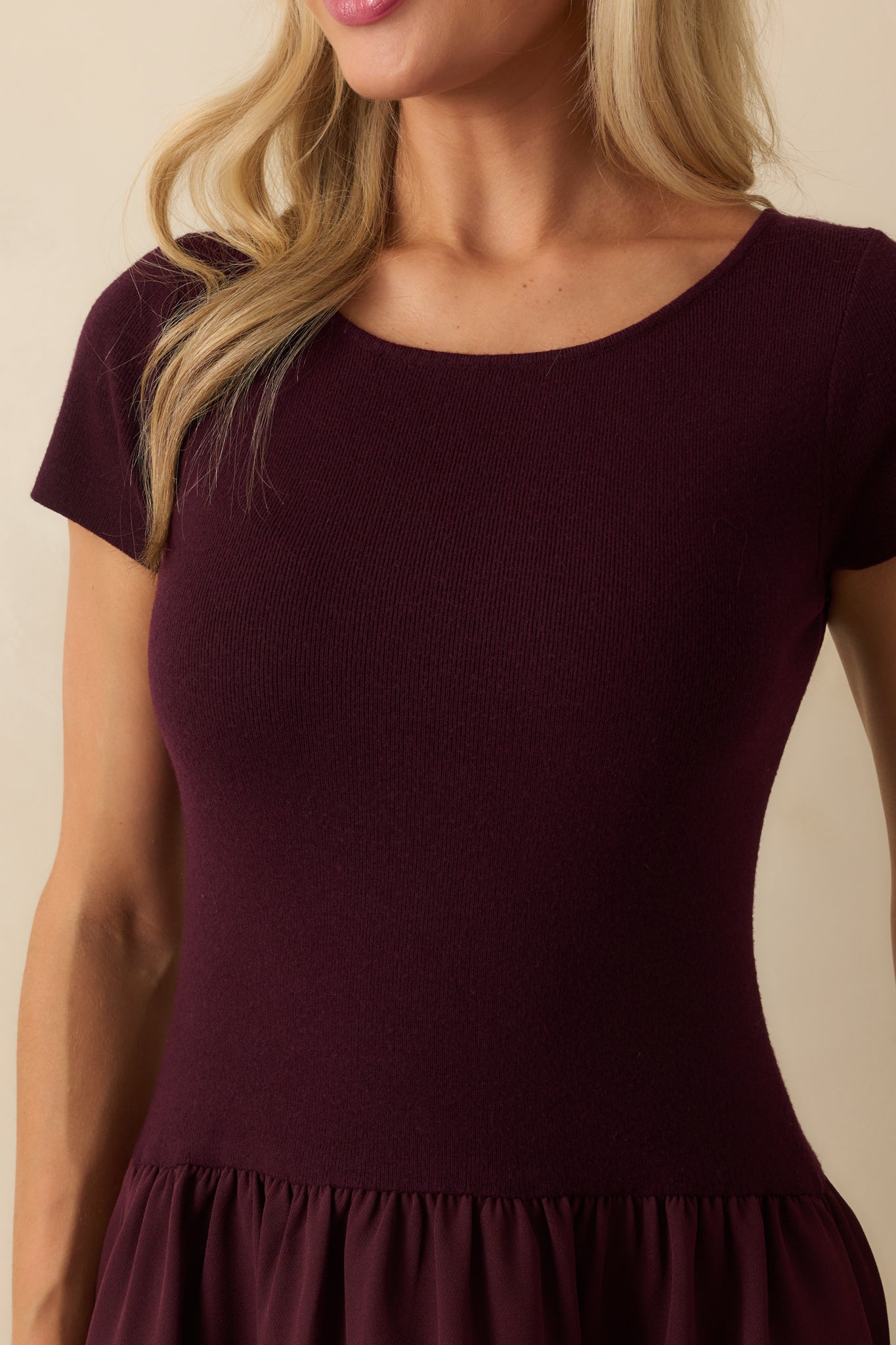 Close-up of the ribbed knit bodice and scoop neckline of the wine red maxi dress.