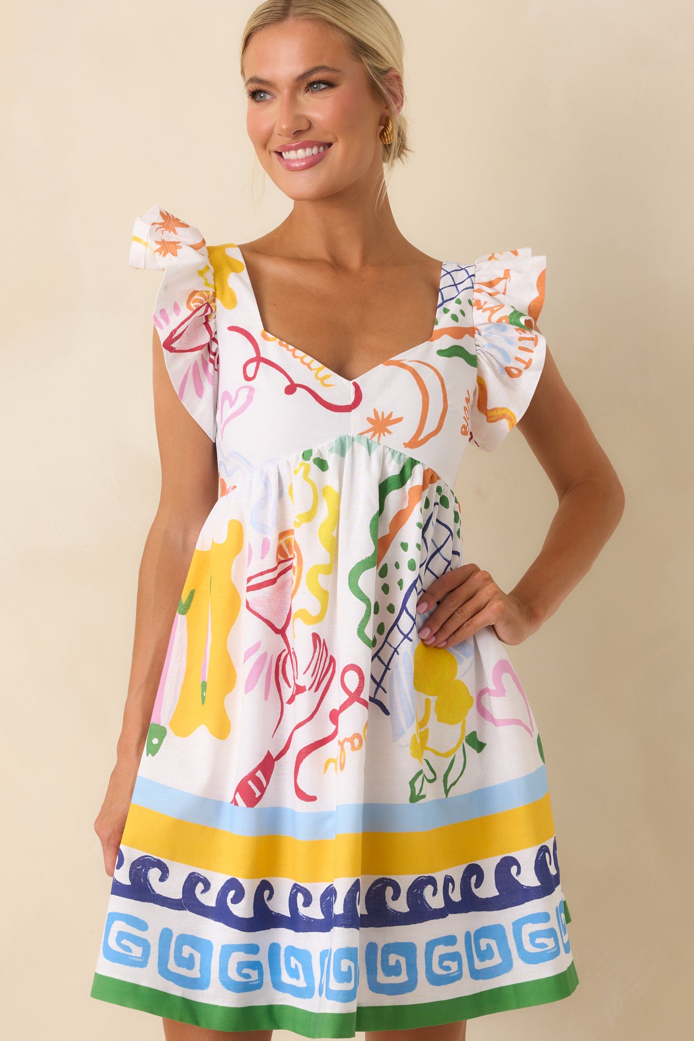 Cropped shot of the shoulder and sleeve area, drawing attention to the flutter detail and multicolor pattern